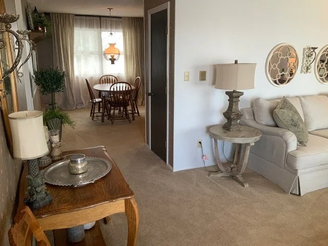 Living room with dining room in background