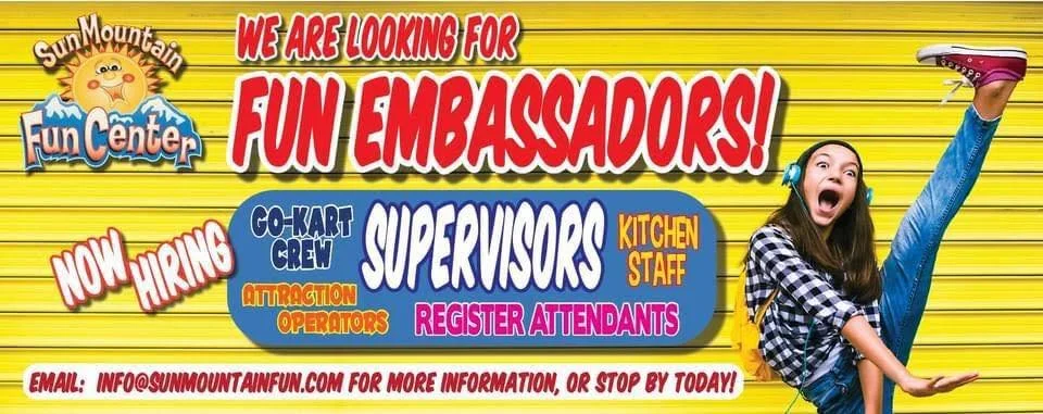 A colorful advertisement for Sun Mountain Fun Center seeking fun ambassadors, including roles such as Go-Kart Crew, Superversors, Kitchen Staff, Attraction Operators, and Register Attendants, with a picture of a girl doing a high kick and showing excitement.