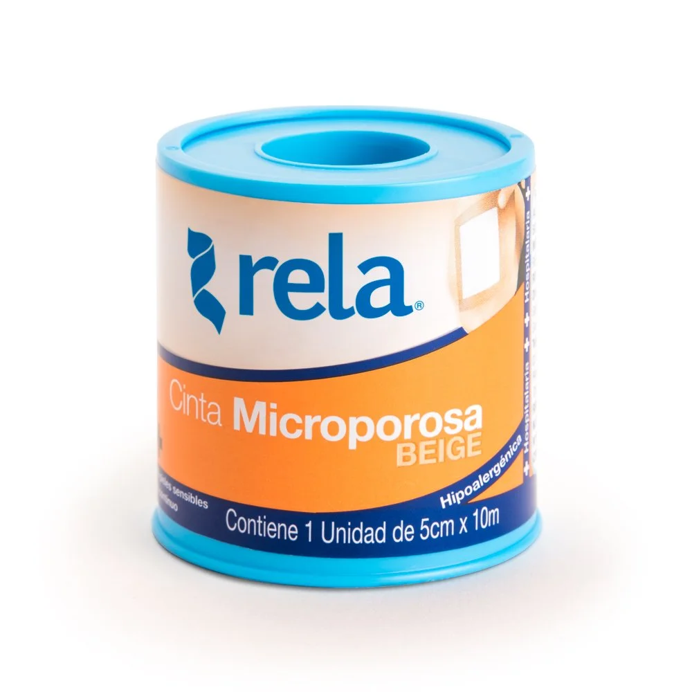 Scenic landscape of mountains, lake, and rolling grassy hills under cloudy sky.