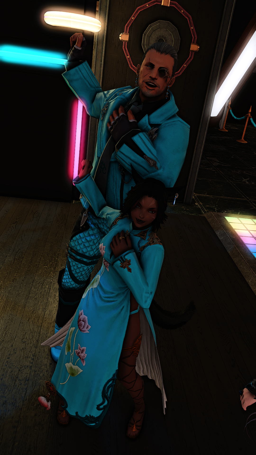 Two characters dressed in futuristic or fantasy costumes posing in a dimly lit neon-lit room, with one leaning against a wall and the other standing with one hand on their chest.