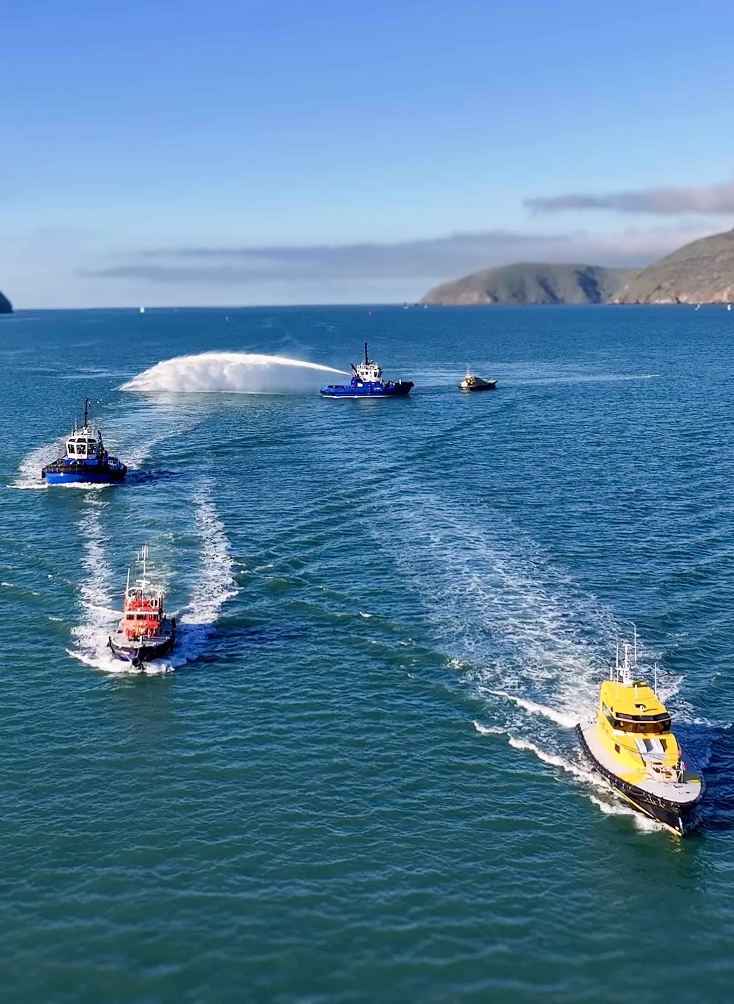 Several boats sailing in the ocean