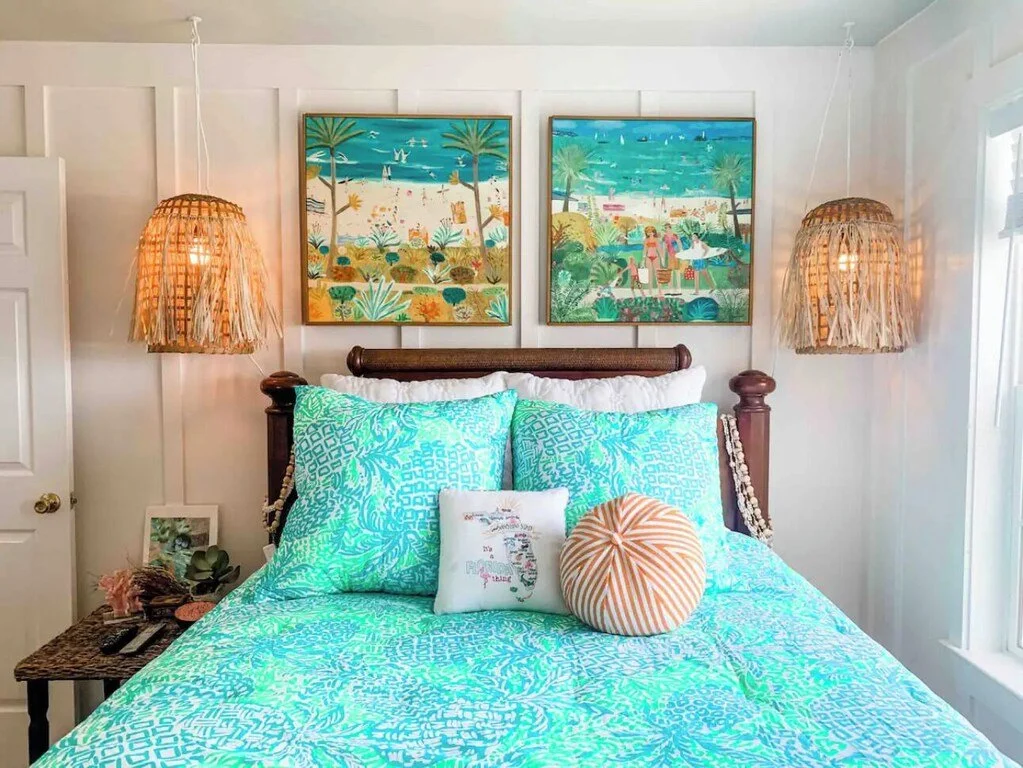 Beach-themed bedroom with ocean-themed artwork, turquoise bedding, and beach décor.