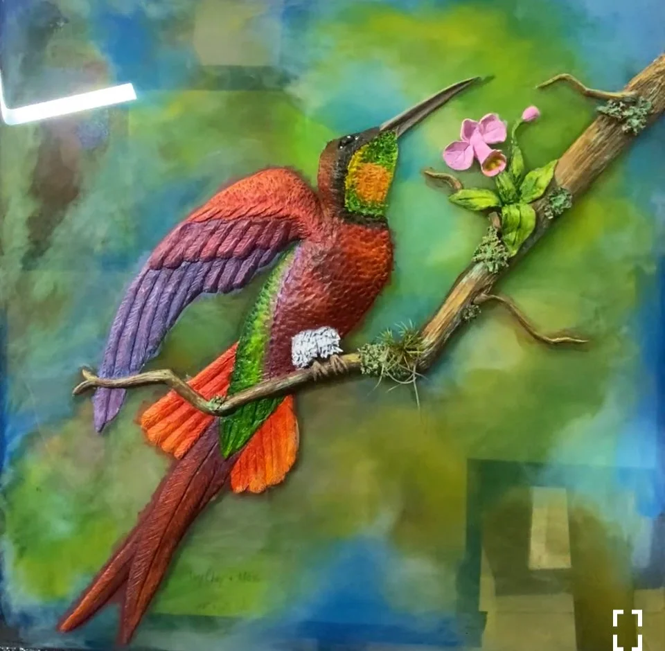 Crimson Topaz Hummingbird 
Resin on Glass Frame 3D Air-Dry Clay Bas-Relief
17.5" x 17.5 " 20 oz. Resin 