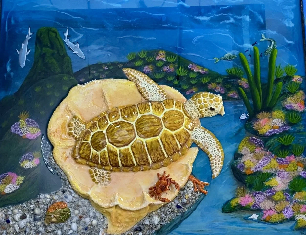 Lazy Turtle
A stunning resin art piece featuring a turtle resting on a giant sea sponge at the rocky edge of a seascape
25" X 21"  32 oz. Resin