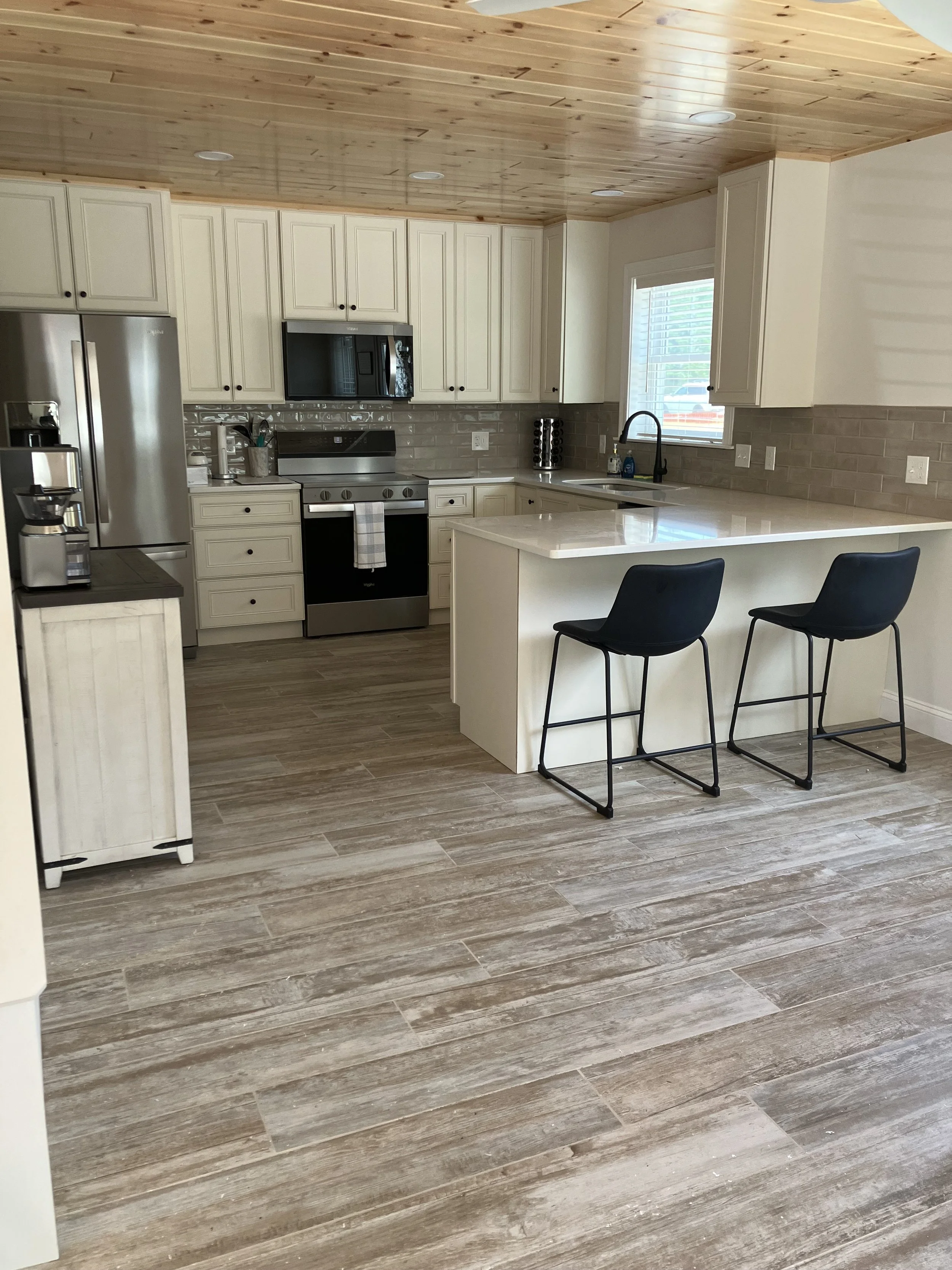 Spacious Kitchen Featuring Bar with 2 Stools, Coffee Station and All New Appliances