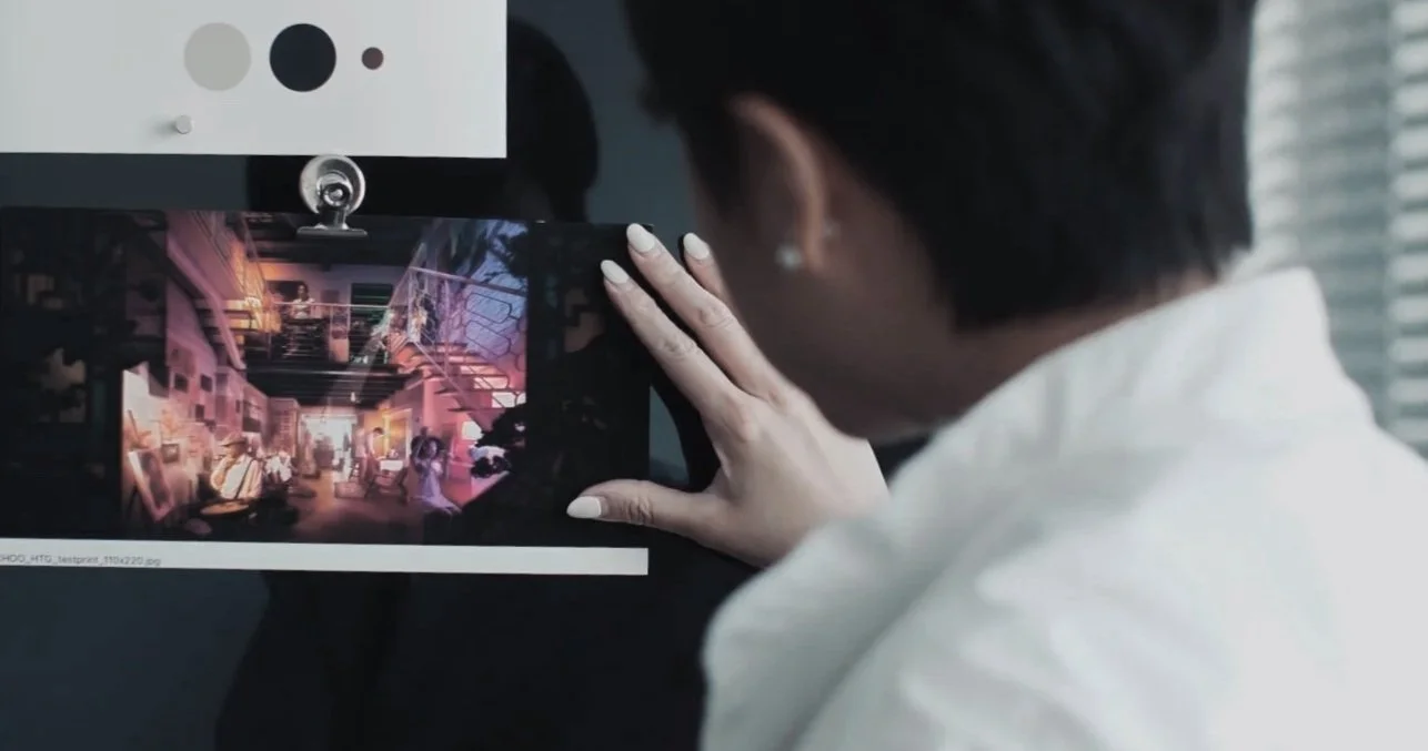 Person taking a photo of a colorful indoor scene on a smartphone, with the photo displayed on the phone's screen.