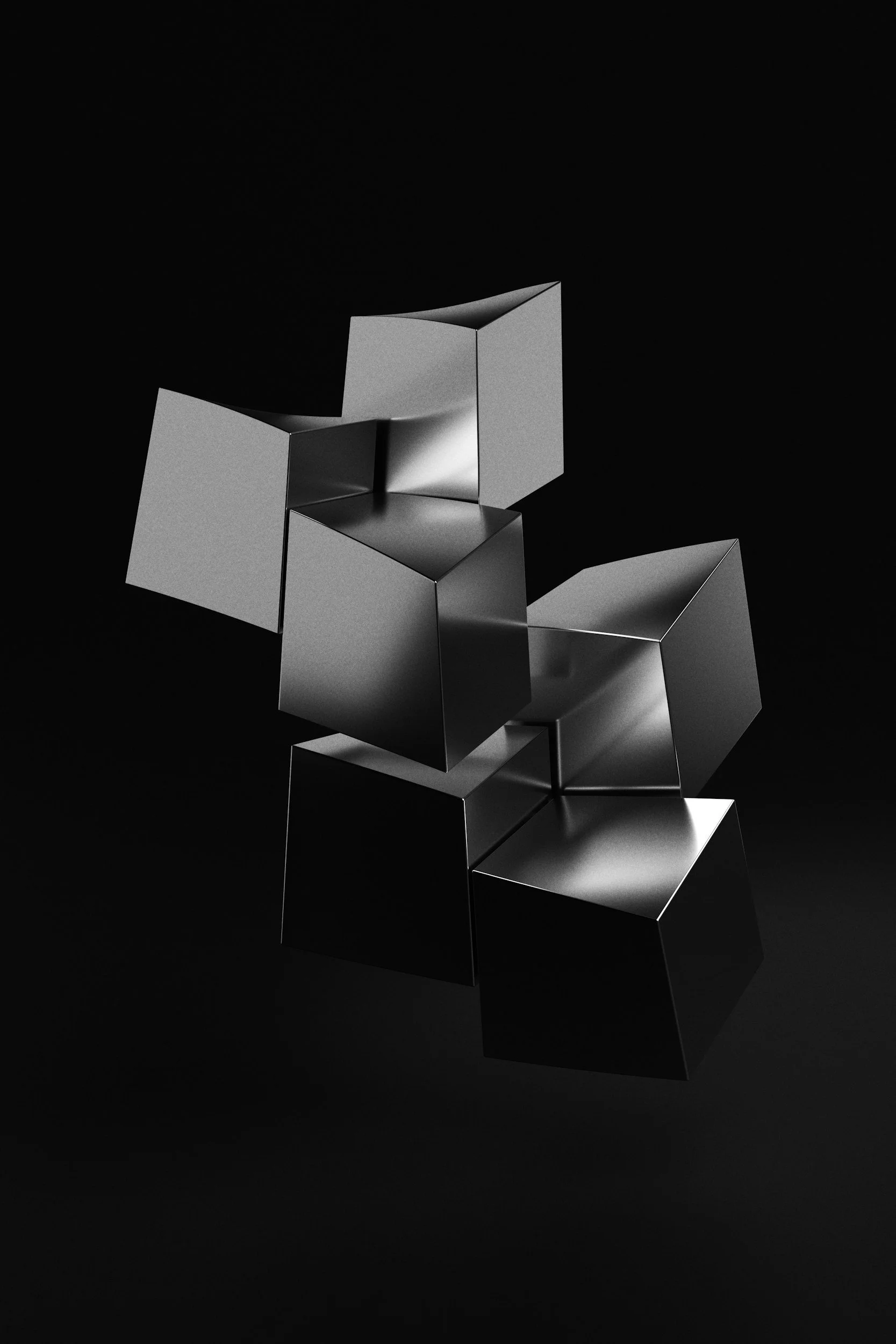 A minimalist, abstract composition of metallic black and silver geometric cubes arranged on a black background.