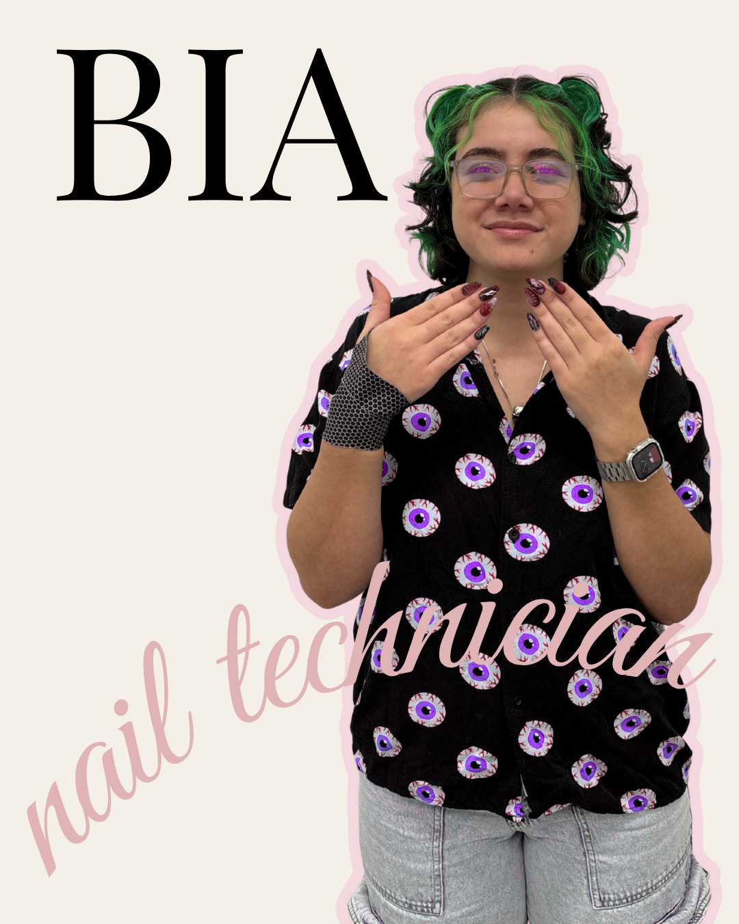 A person with green and black hair, wearing glasses, a black shirt with purple and white eye patterns, and grey shorts, holding their hands near their face with nails painted in dark colors. The background has text that says "BIA" and "nail technician" in pink cursive.