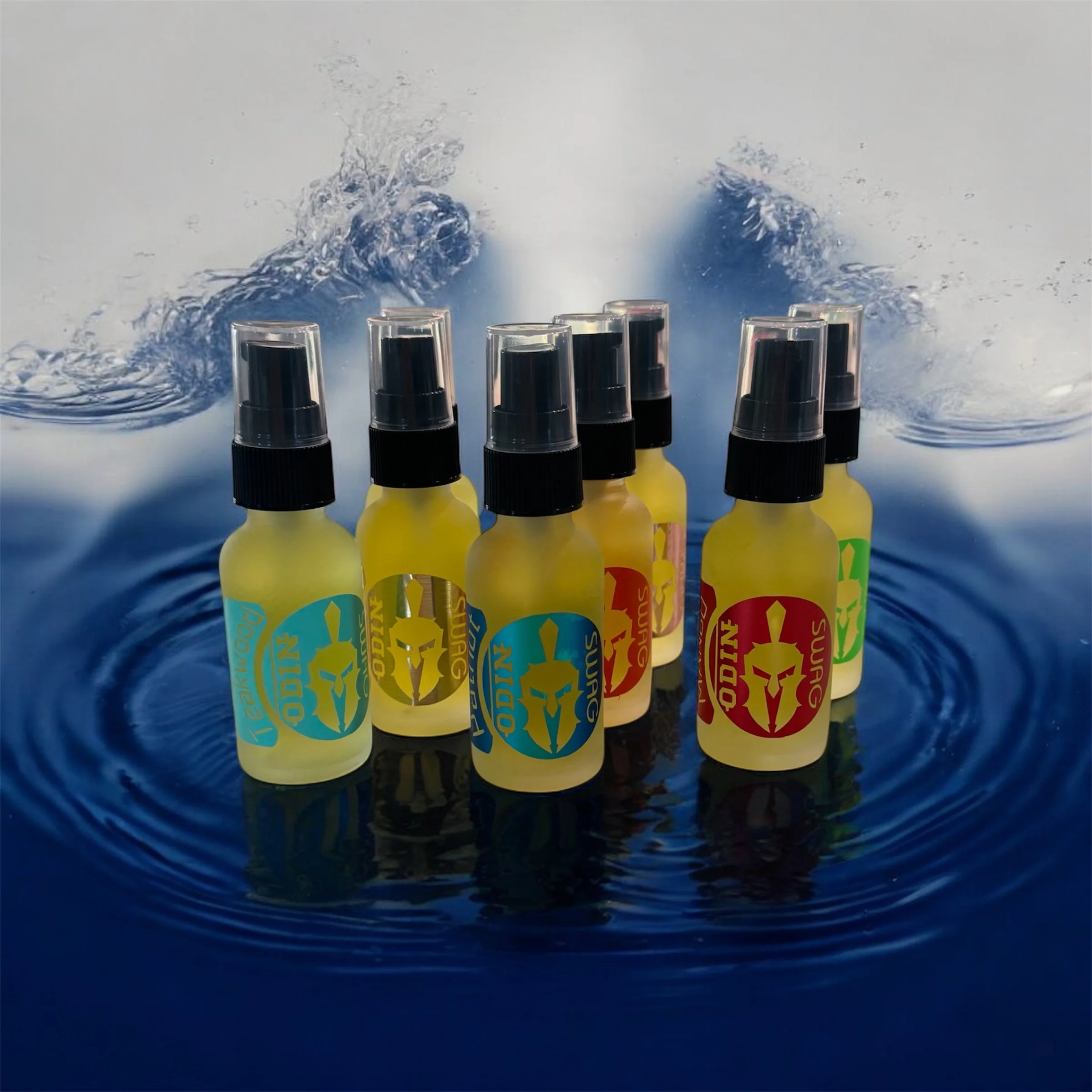 Seven small spray bottles with black spray nozzles and colorful labels, placed on a reflective surface with water splash effects in the background.