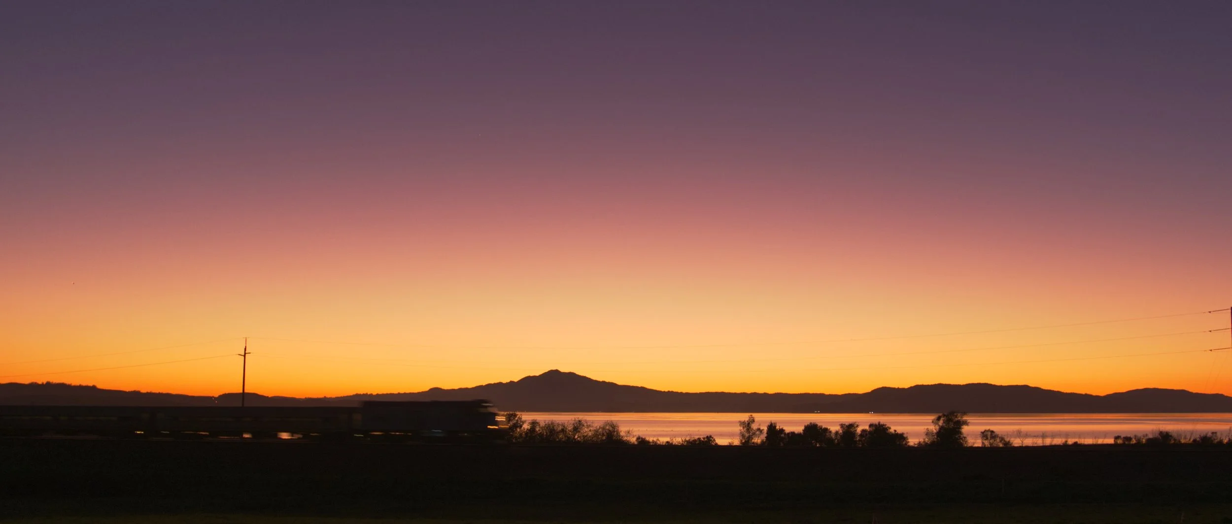 Giant_Highway_Sunset_Train_Mountains_Water.jpg