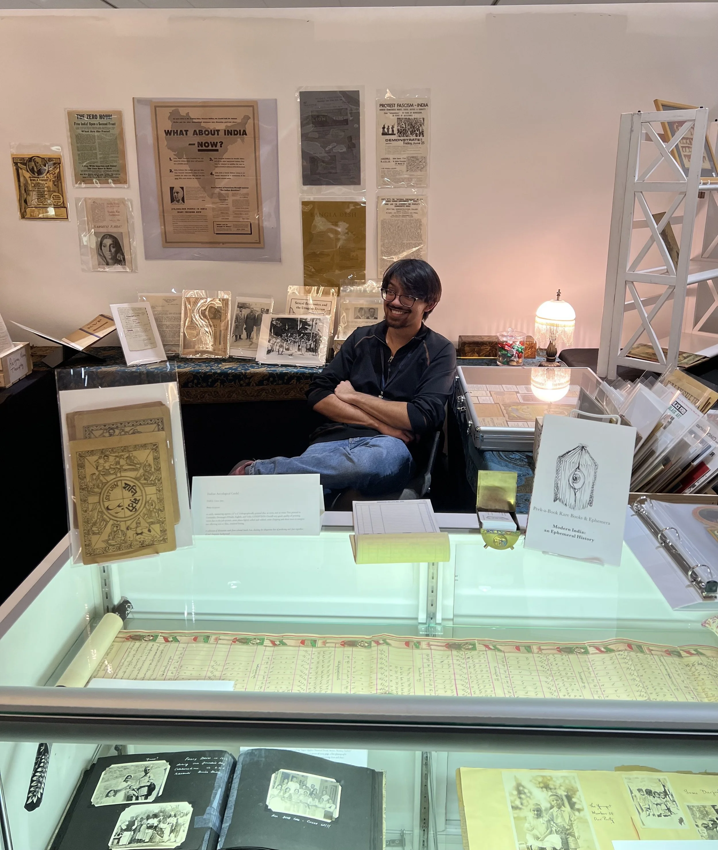 Pico cheerily inside his booth at the Ephemera Society Fair, 2026.
