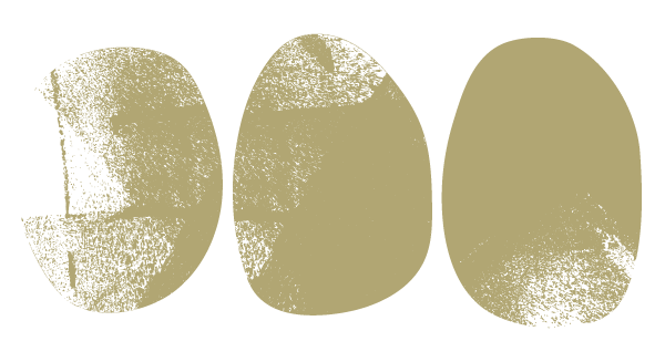 Close-up of three beige eggs on a black background.