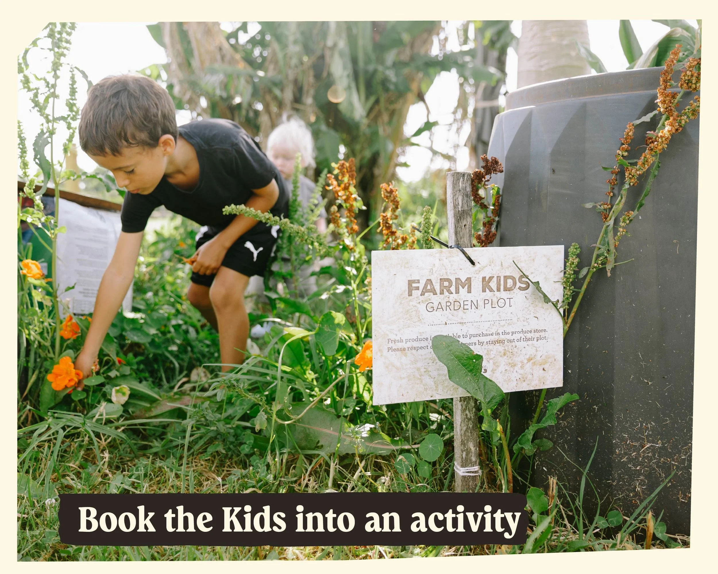 Kids exploring a garden, with a sign that reads 'FARM KIDS GARDEN PLOT', surrounded by green plants and flowers.