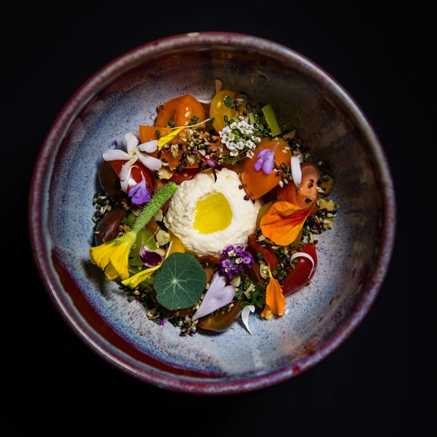 Summer&rsquo;s Bounty in the Napa Valley
A vibrant celebration of the season, showcasing sun-ripened local cherry tomatoes over a silky smoked tomato pur&eacute;e. Paired with crisp sesame-quinoa granola and @bellwetherfarms ricotta, delicately whipp