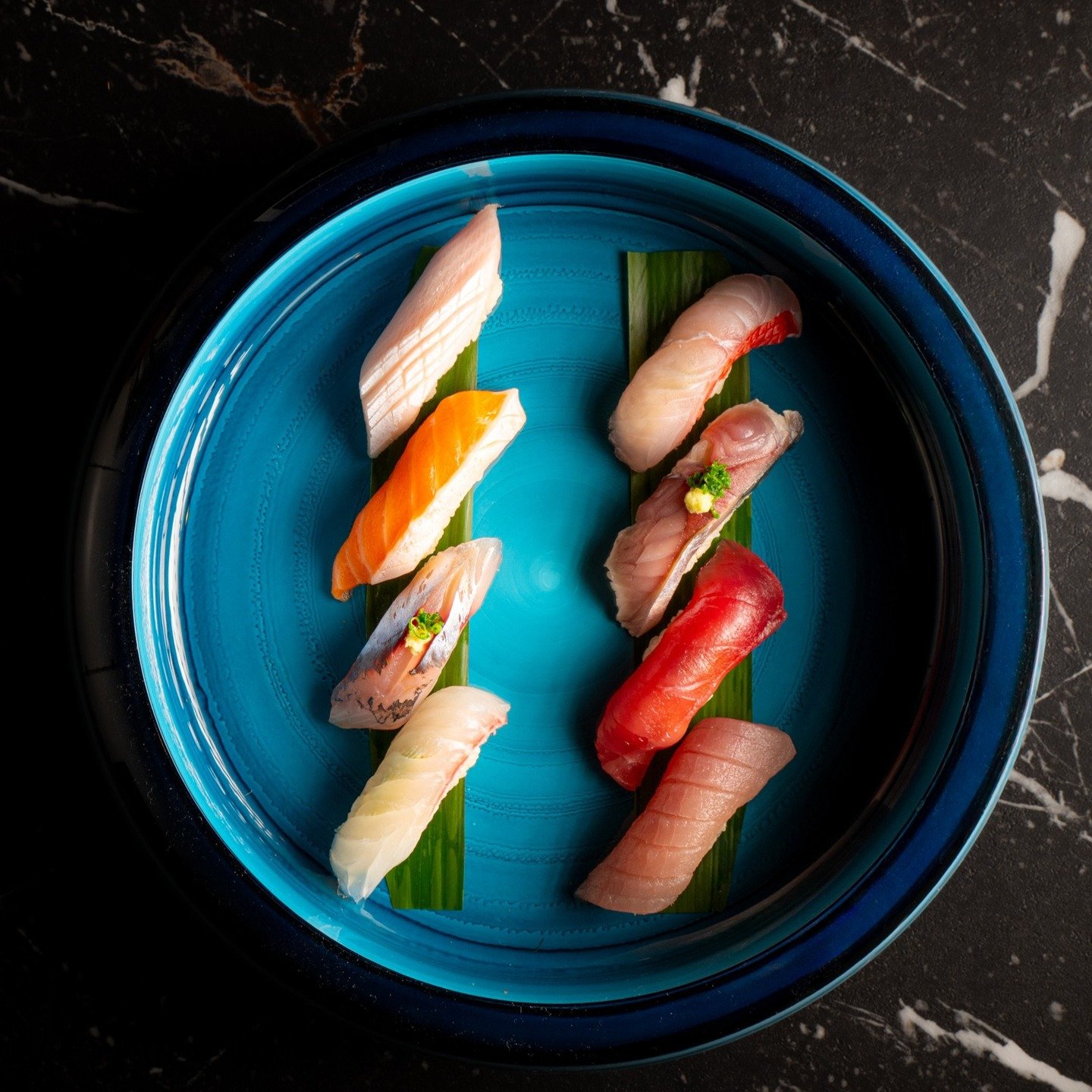 Five Senses Nigiri Selection
An expression of respect for sea, season, and tradition. This selection brings together the finest fish from Japan and the coastal waters of Northern California. Each piece is formed with quiet precision, seasoned Koshihi
