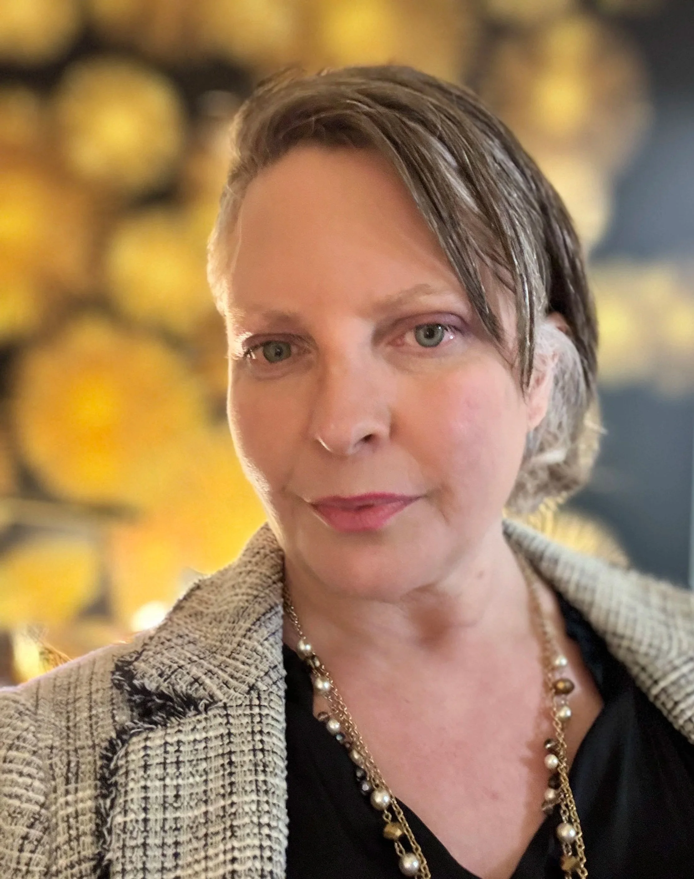 Portrait of Rachel Young, nurse advocate and storyteller, offering guidance and support for caregivers navigating complex healthcare challenges.