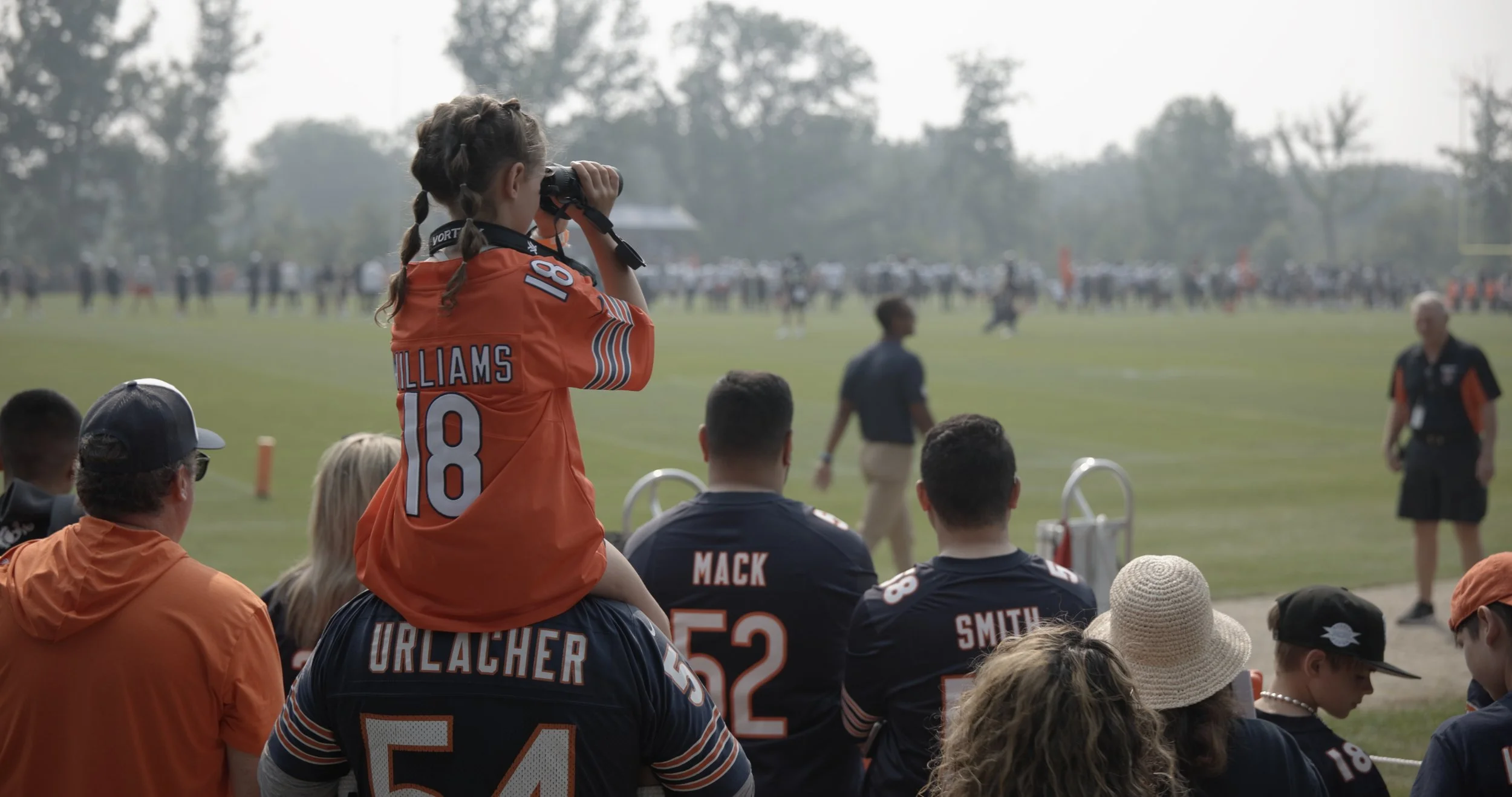 Girl in Williams Jersey on father shoulder .jpg