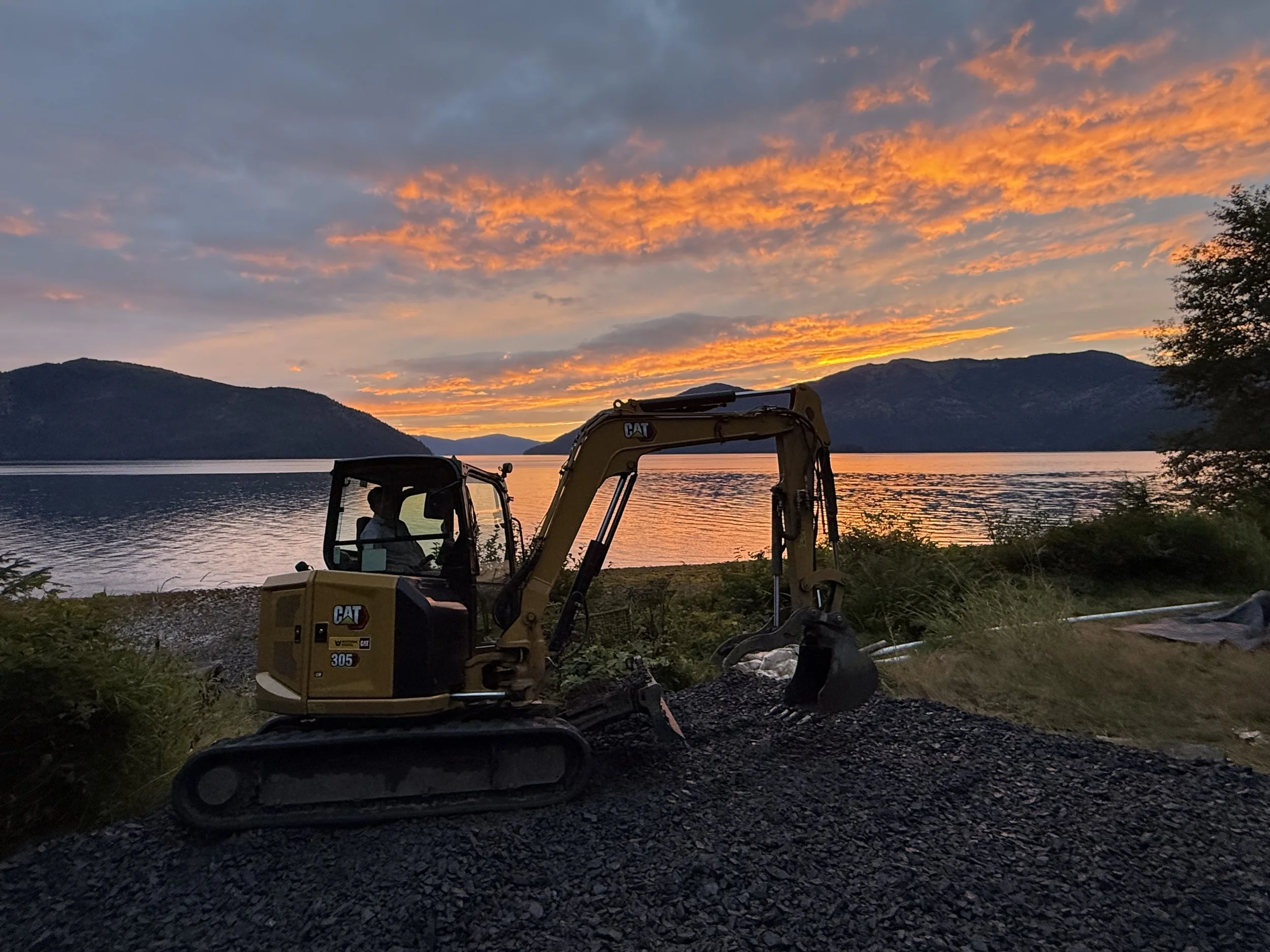 Jeff enjoying the sunset at the end of a long day. This property will be a vacation rental starting in 2027, and we can only imagine the guests will be as enthralled at the view as we are.