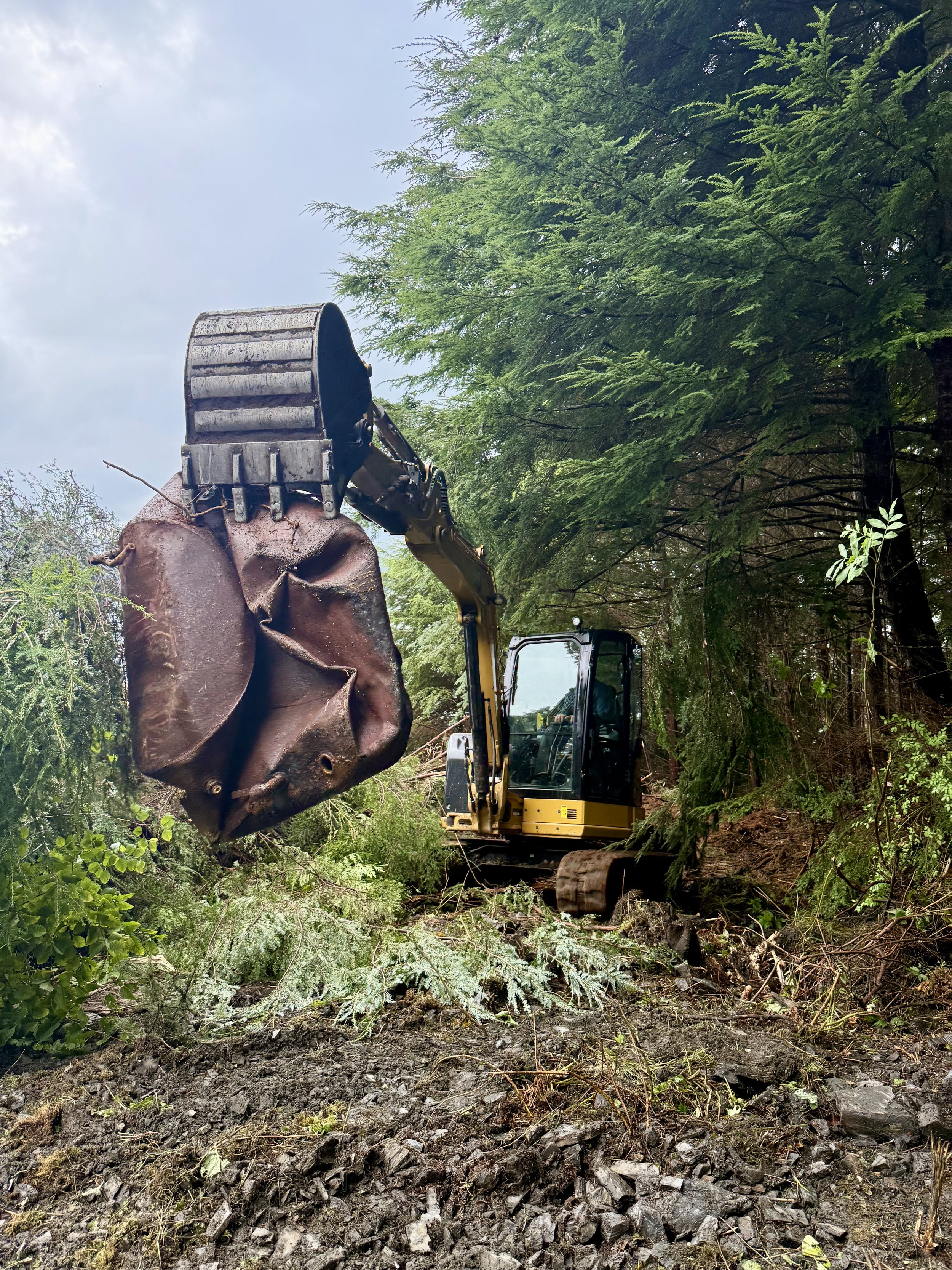 Sometimes our job involves surprises as we disturb the land. Here Jeff finds an old fuel tank.