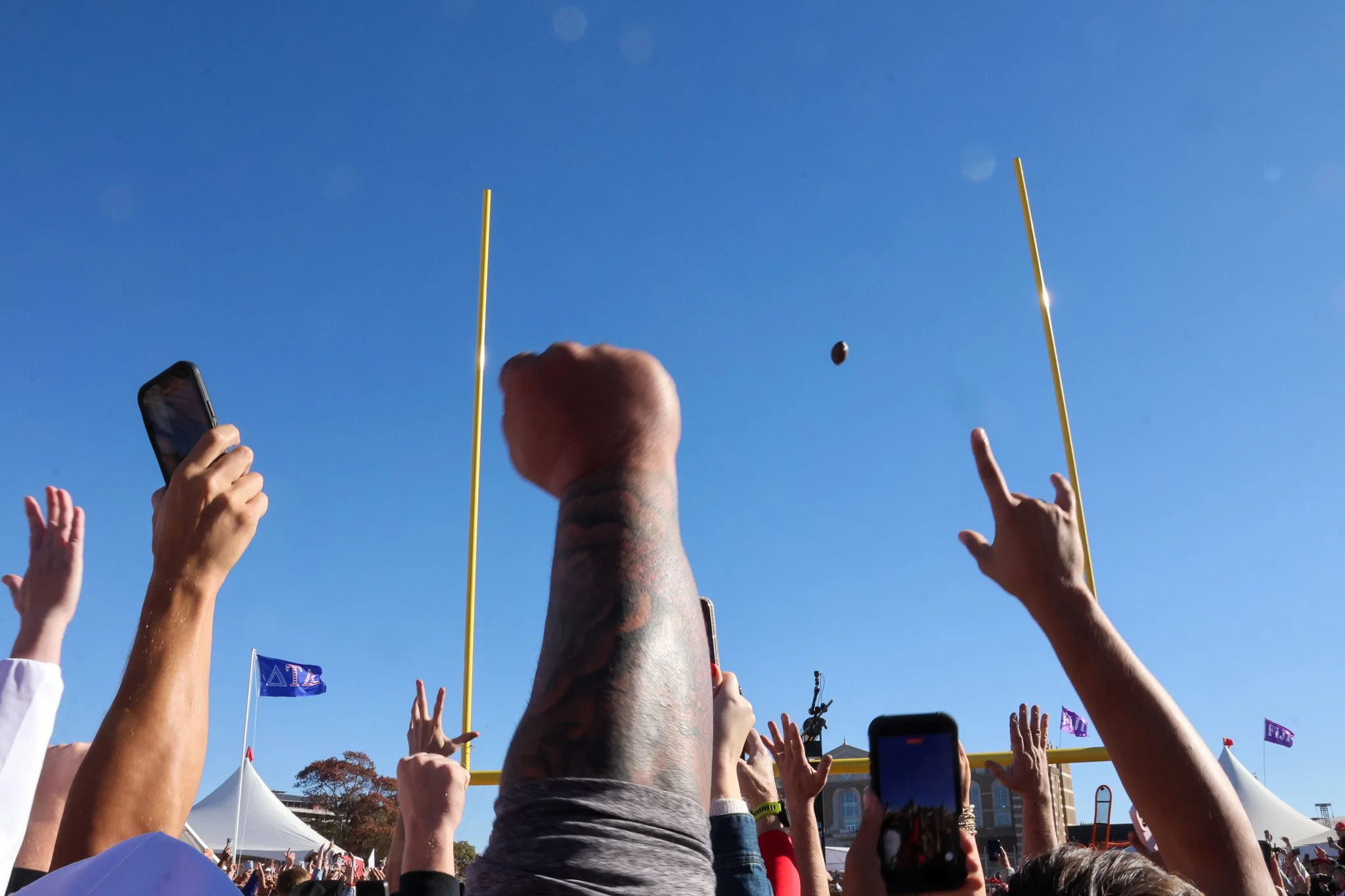 Red Raider fans cheer as a football kicked by Texas Tech student John Machtolff sails through field posts during Pat McAfee’s Kicking Contest on ESPN's College GameDay on Nov. 8, 2025 in Lubbock, Texas. Machtolff missed his first attempt but made his
