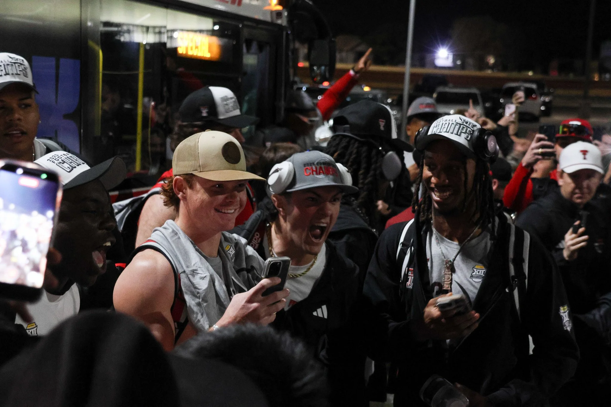 Texas Tech's wide receiver Coy Eakin and quarterback Behren Morton and the rest of the Red Raiders pose for photos with fans at Jones AT&T Stadium on Dec. 6, 2025 in Lubbock, Texas. The Red Raiders won their Big 12 Conference title earlier in the day