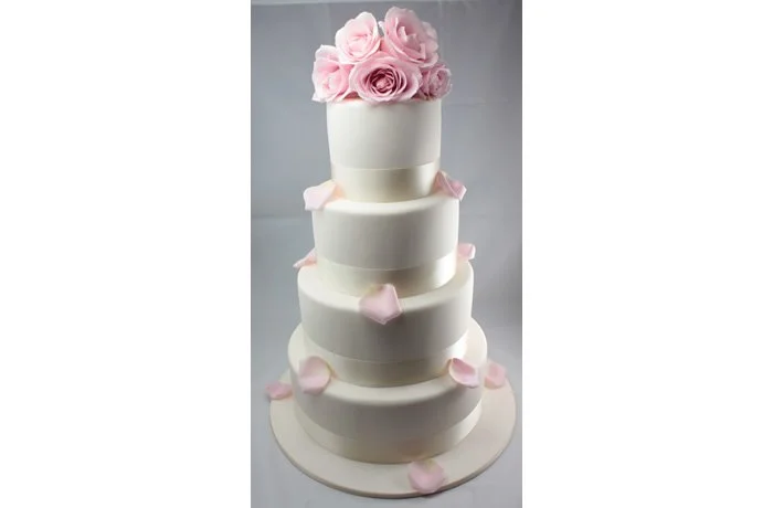 Fresh Flowers - This basic iced cake adorned with fresh flowers from your florist will just top your cake beautifully. Ask us today how we can help with arranging this for you.