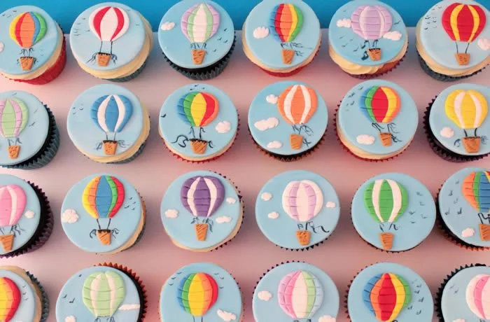 Up, Up and Away! - These fun hot air balloon hand crafted sugar disc are just delightful. Plenty of colour to brighten anyone’s day. Take a closer look to see the detail of birds flying in the back ground!