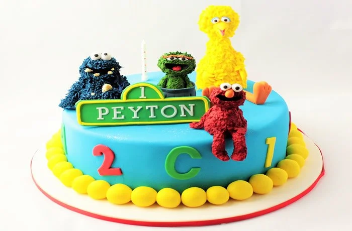 Sesame Street - Just adorable! Hand crafter sugar models sit on top of this birthday cake to make it fun for any little person!