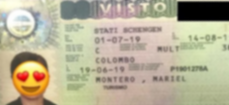A blurry image of an airline boarding pass with a heart-eyes emoji obscuring the person's face.