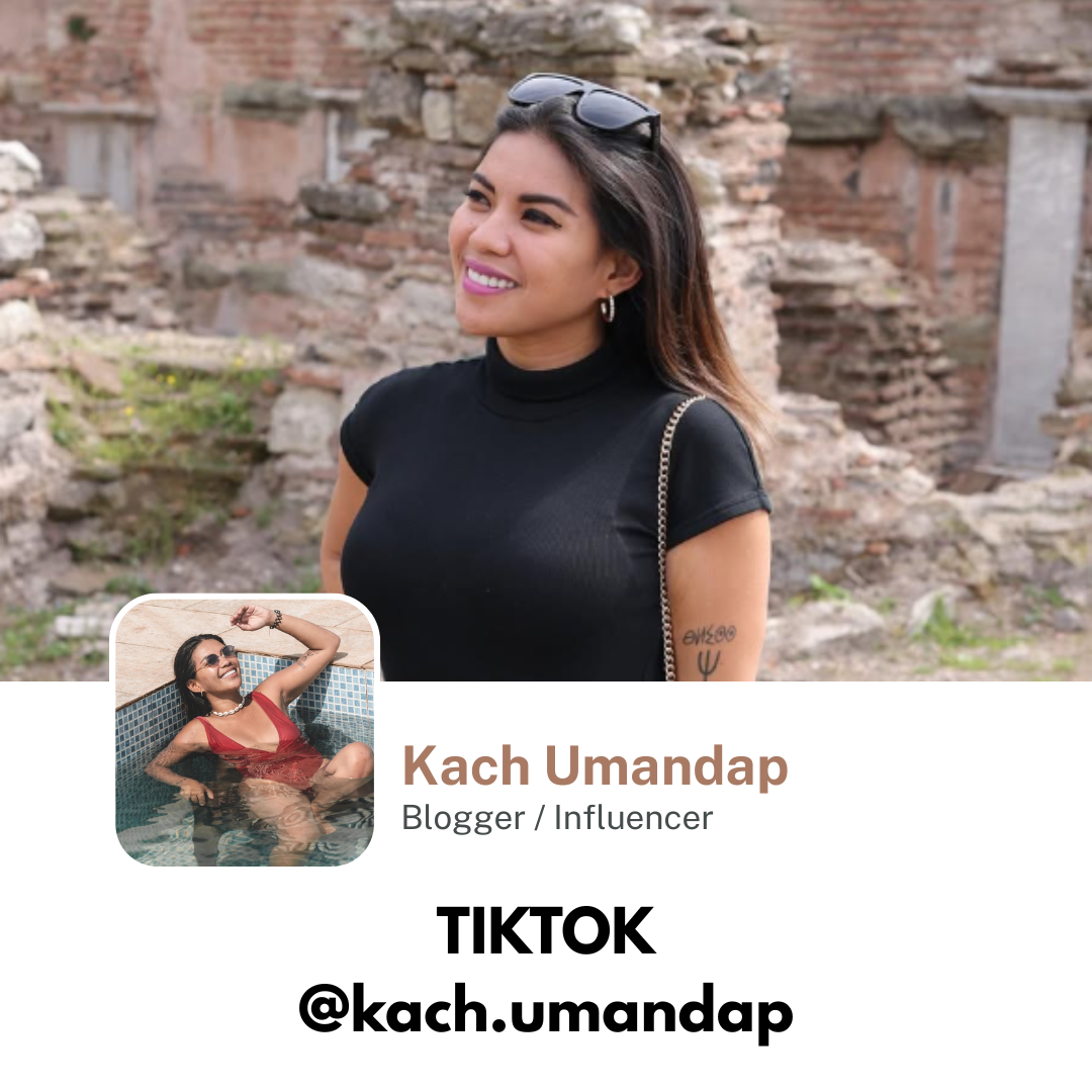 Instagram profile card of Kach Umandap, a blogger and influencer. The card features a photo of a woman with dark hair, wearing a black turtleneck t-shirt and sunglasses on her head, standing in front of ancient ruins. Her profile picture shows her submerged in a pool, wearing a red swimsuit, sunglasses, and showing a relaxed, smiling pose. The profile name is Kach Umandap, with TikTok handle @kach.umandap.