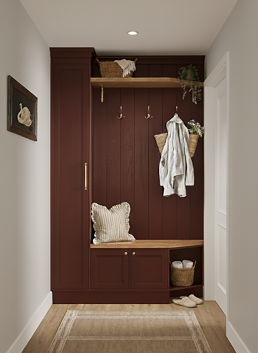 Bespoke built-in cloakroom and entryway storage with deep red shaker cabinetry, oak bench and shelving, brass coat hooks and integrated shoe storage.