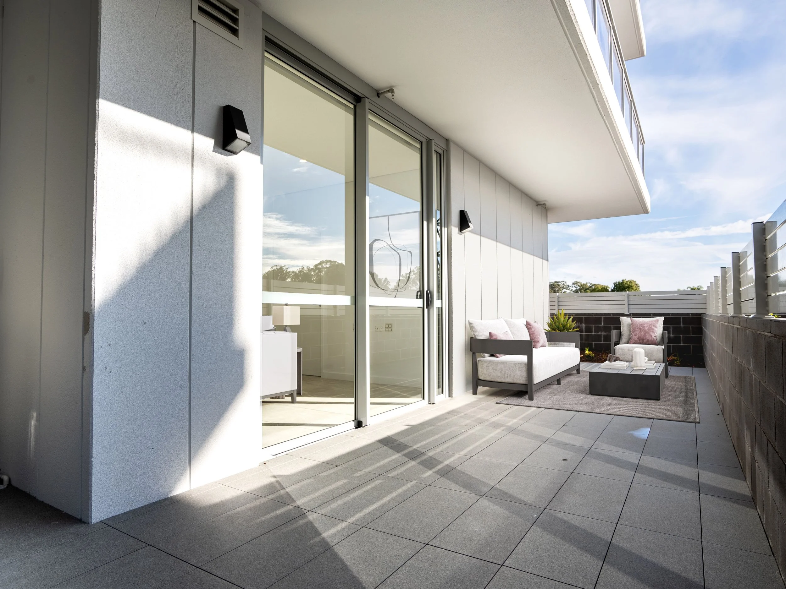 Big balcony with seating chairs and small table