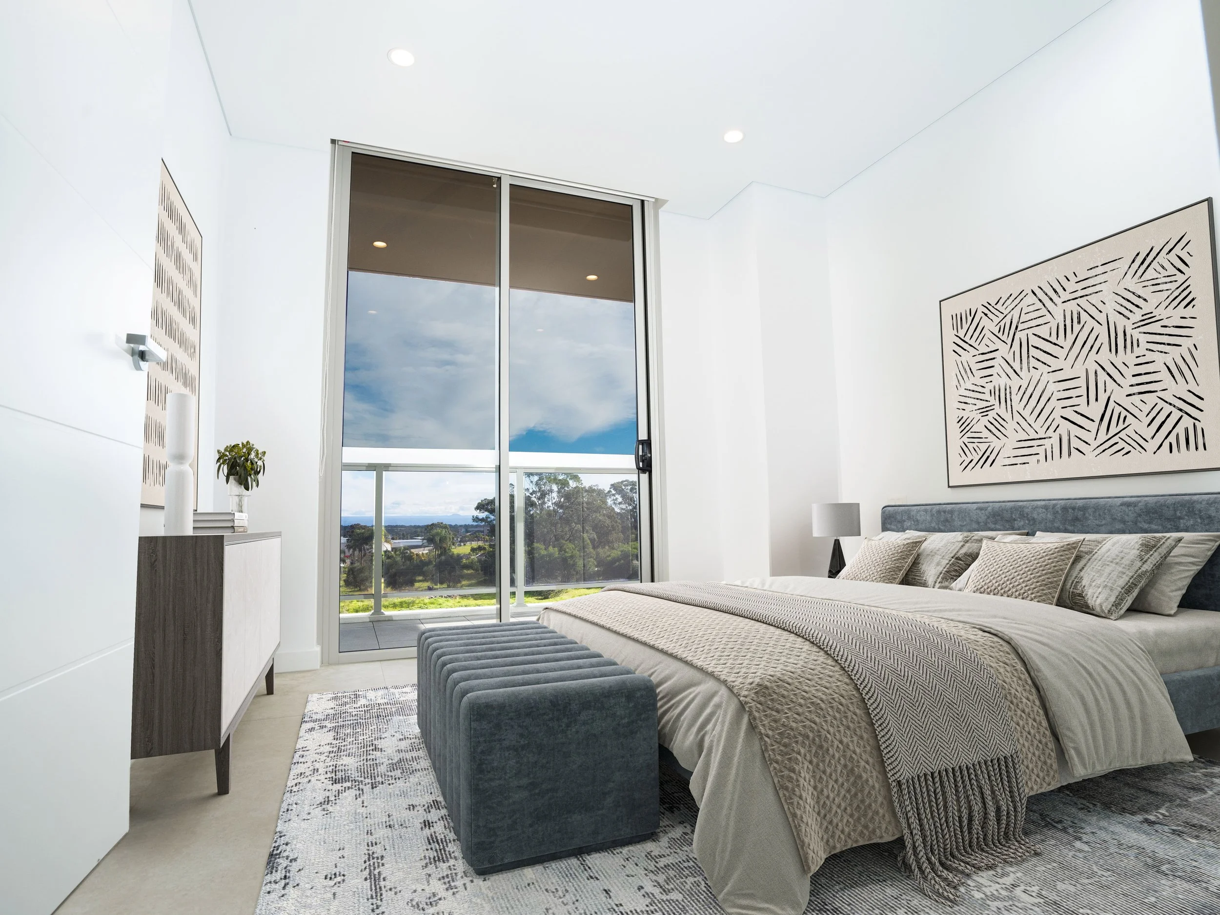 Bedroom with kingsized bed and access to balcony