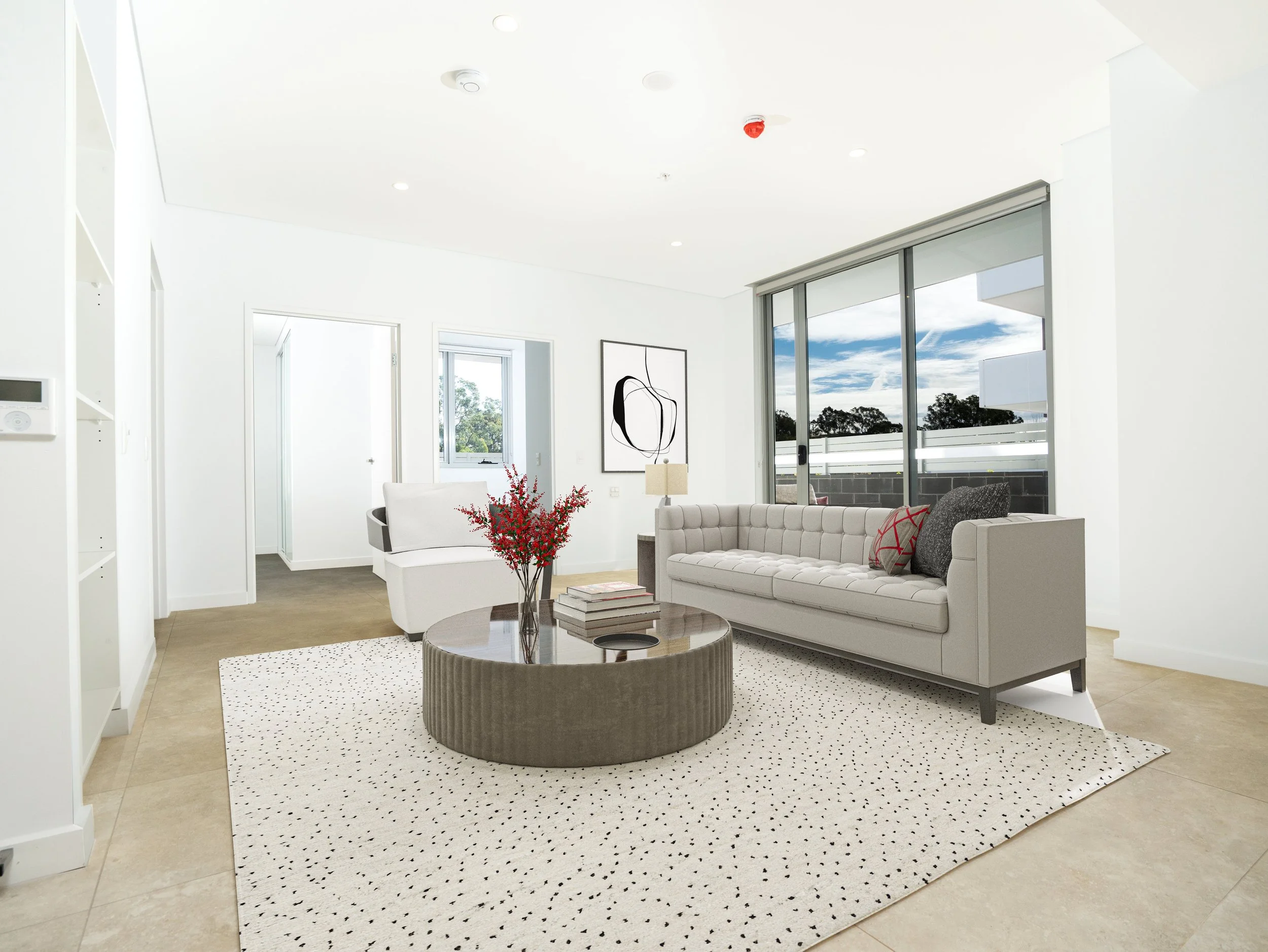 Living room with sofa and small table with plant on top of it