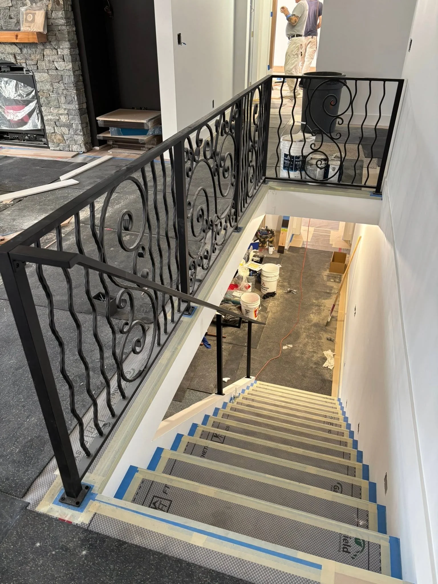 new build home with custom built metal stair railings