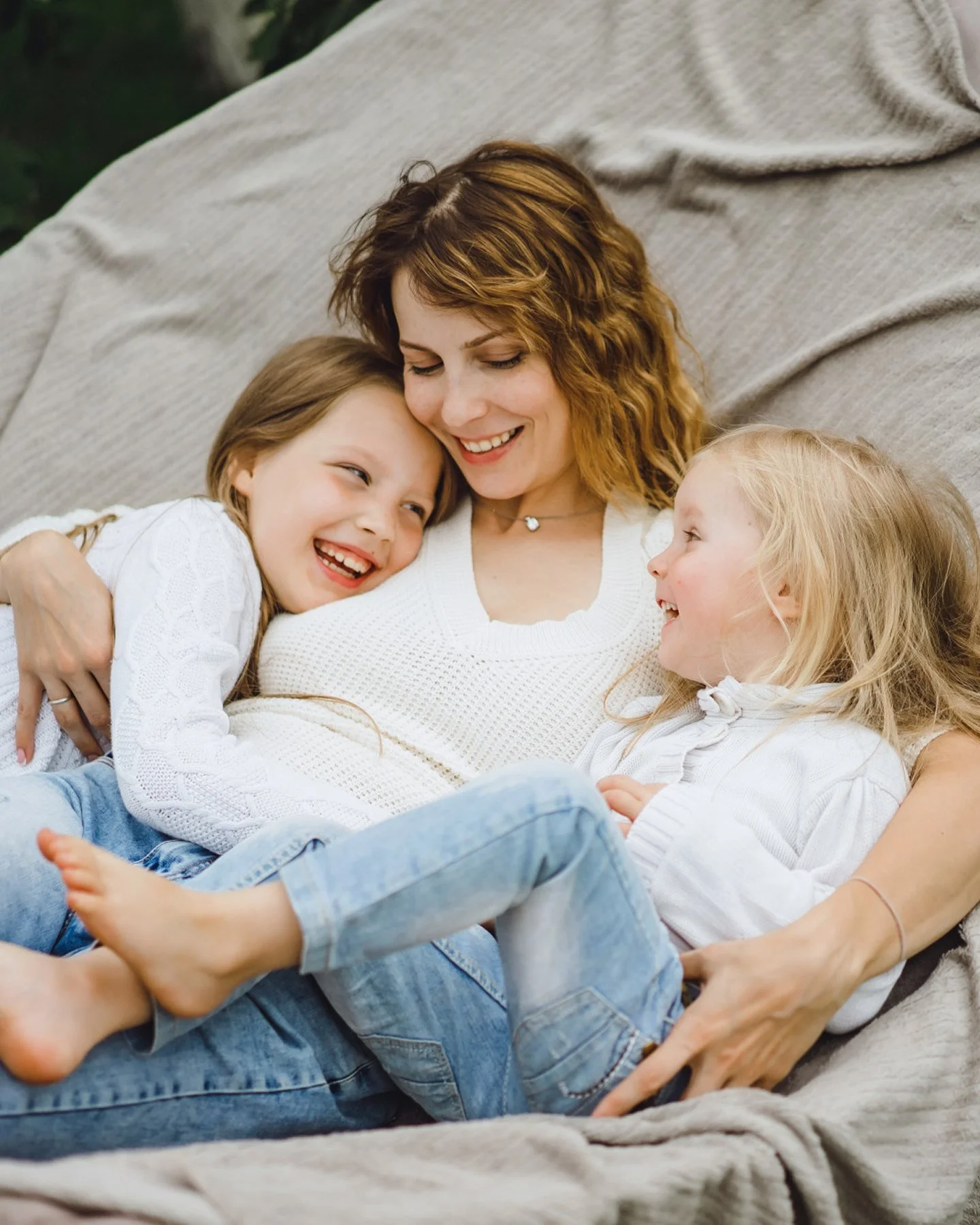 Mother hugging her two children, family law and estate planning services