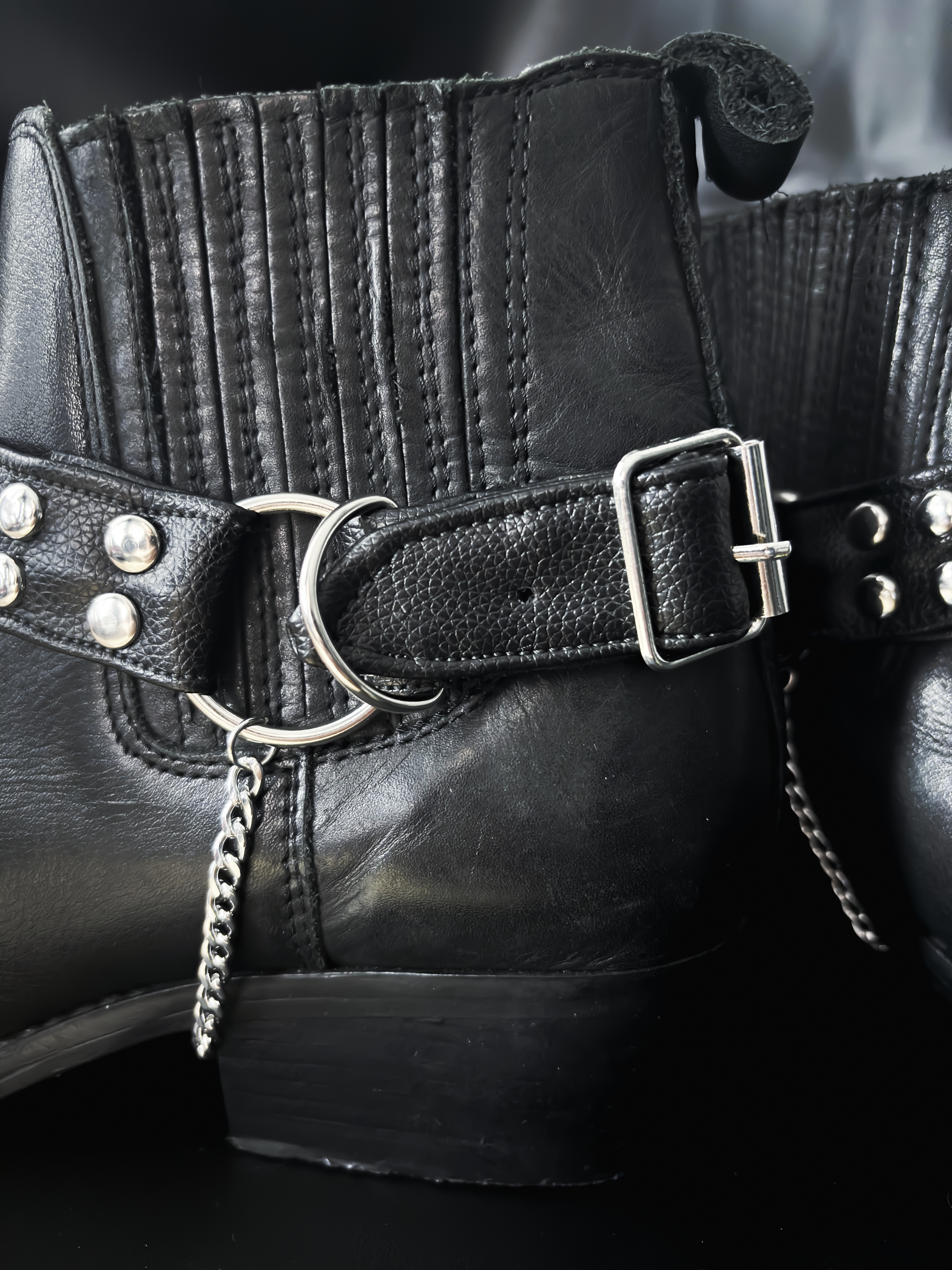 Pair of studded boot straps styled with chain detail under the heel. Minimalist design inspired by classic metal aesthetics