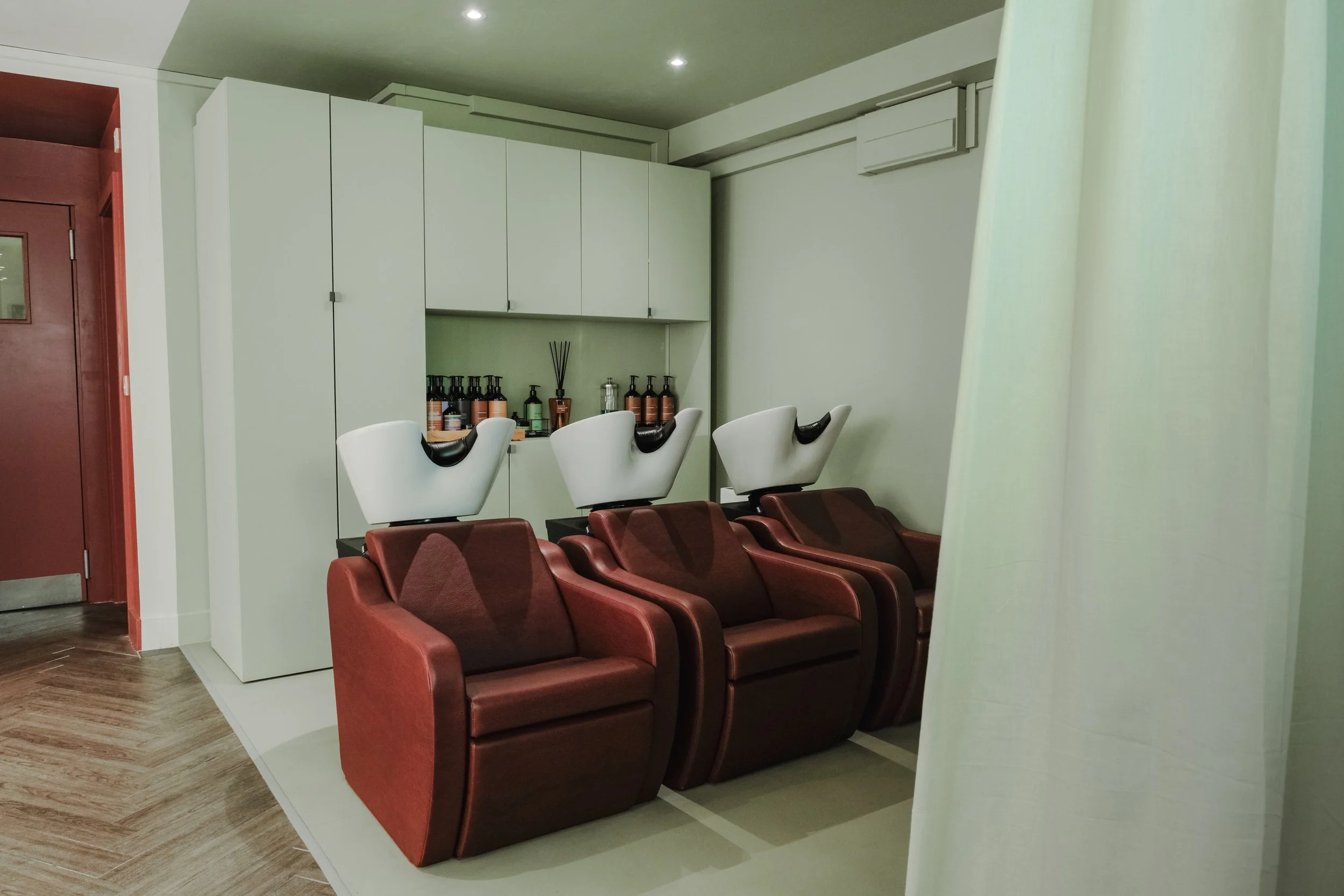 Professional backwash area at Alto Hair Studio, featuring purified water for every hair appointment.
