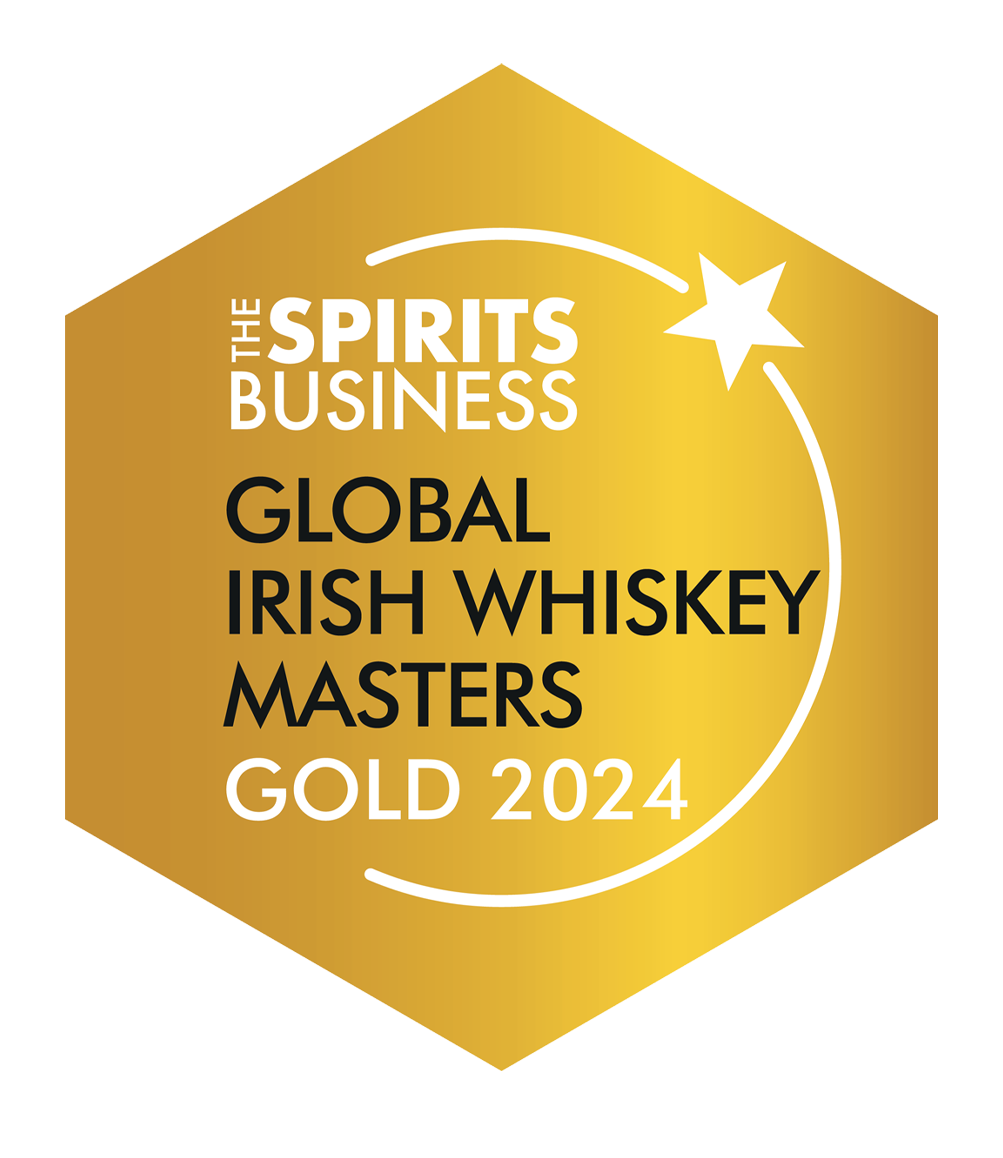 Gold badge with the text "The Spirits Business Global Irish Whiskey Masters Gold 2024" and a white star and curved line design.