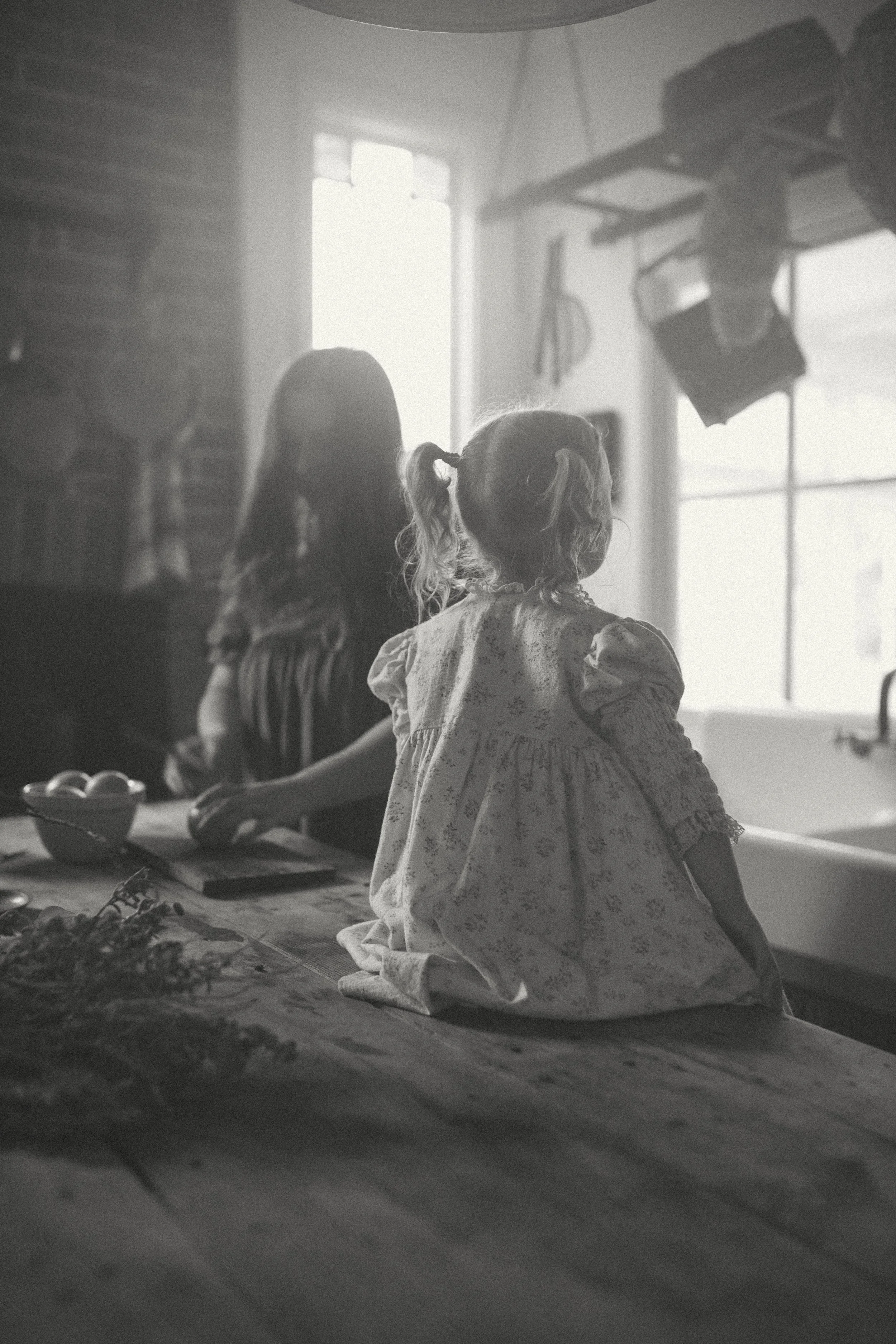 black-and-white-motherhood-photo-country-kitchen-toddler-natural-light.jpg