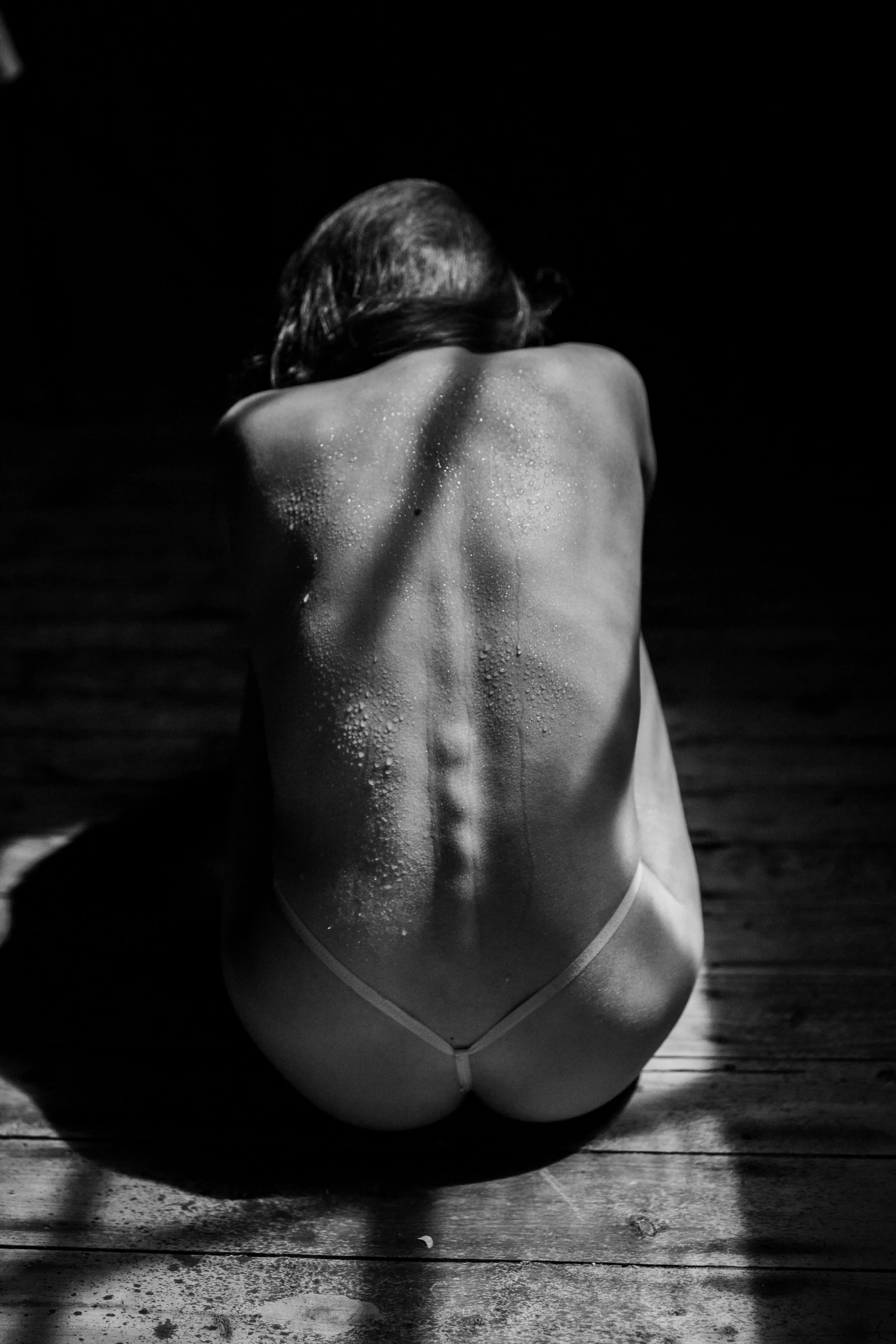 self-love-photoshoot-woman-sitting-on-wooden-floor.jpg