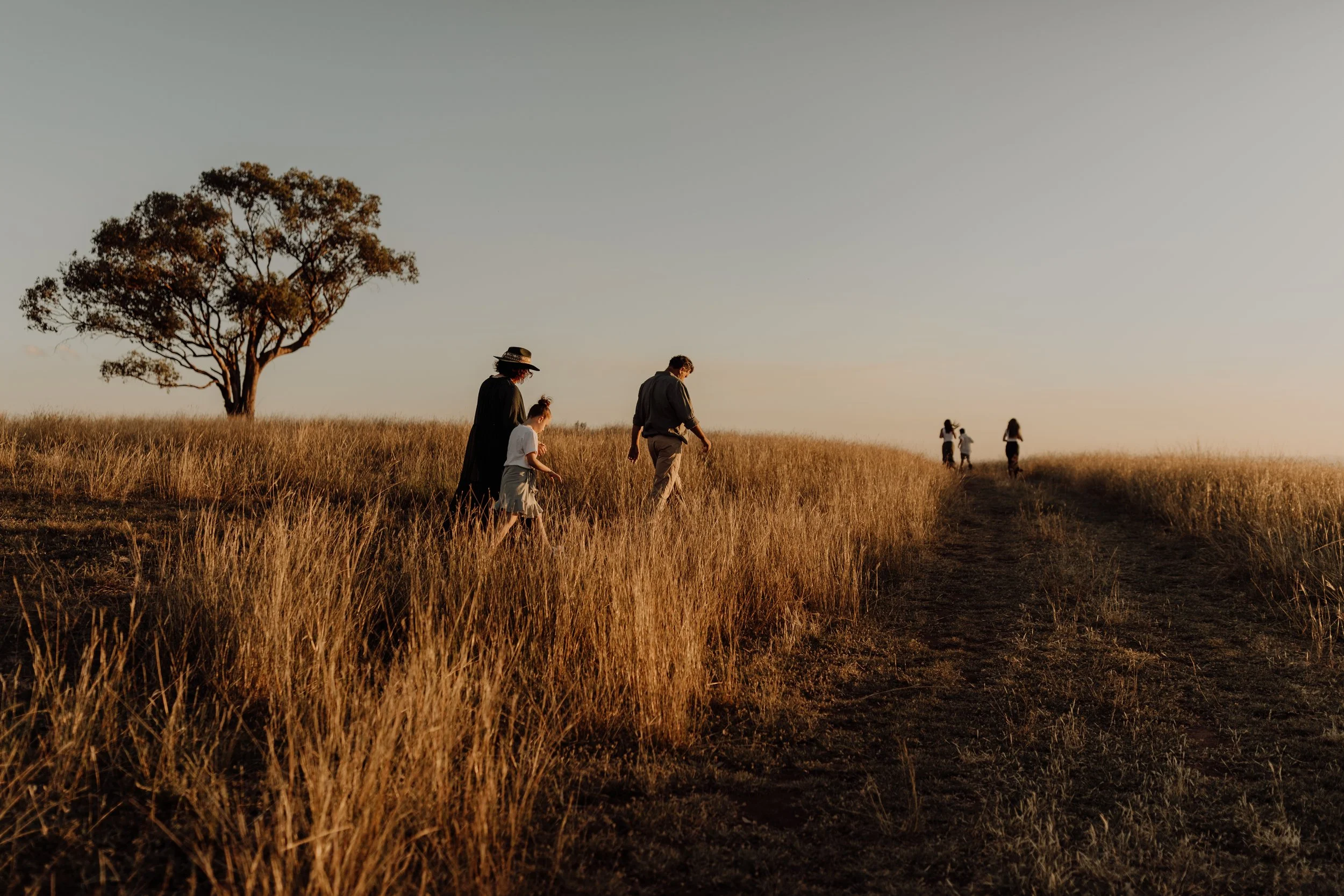 family-walking-on-farm-at-sunset-jade-jones-photography.jpg.jpg