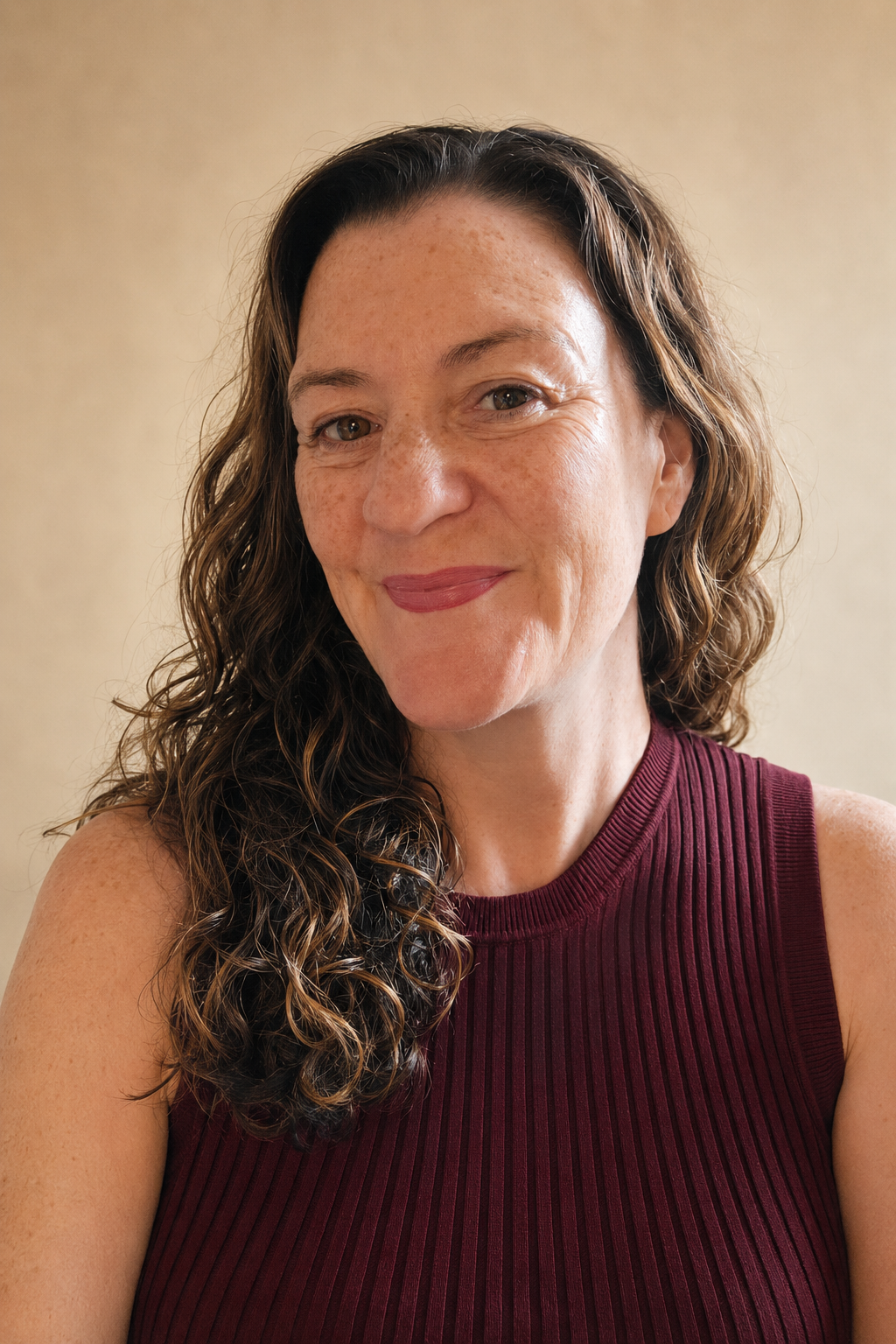 Confident Speaker Portrait in Burgundy.png