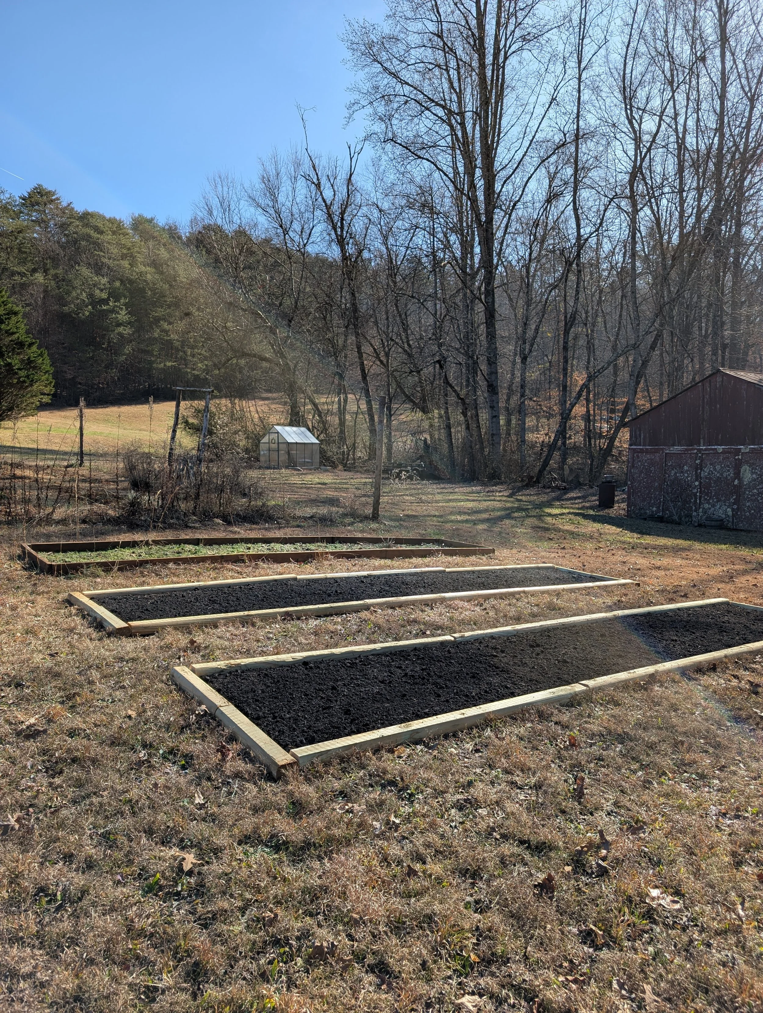 Newly built in ground garden beds prepared in winter for planting lisianthus seedlings at Quinnfield Gardens, a small flower farm.