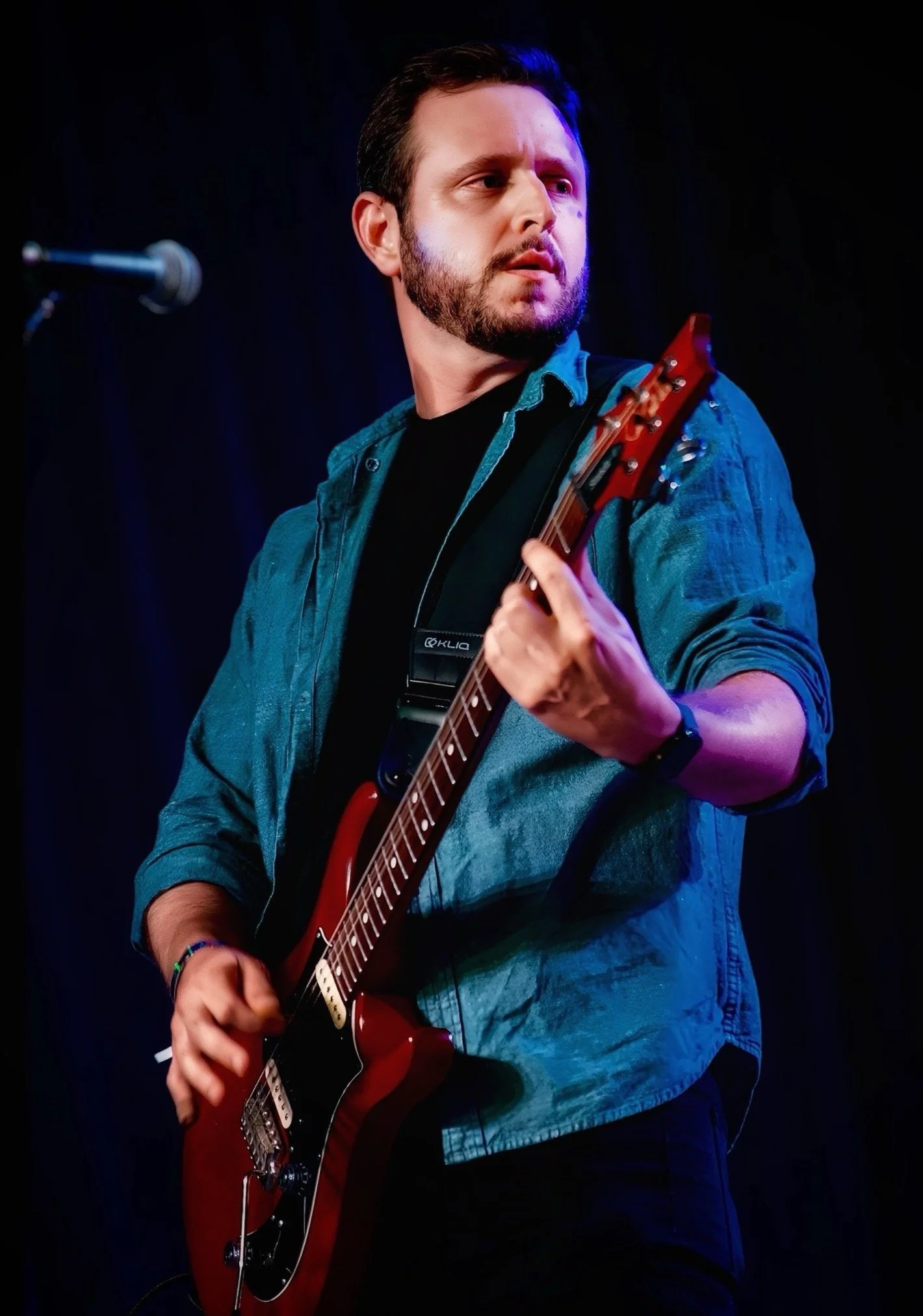 Austin Mann (Noel Hogan) playing the electric guitar live on stage. Guitar player for the cranberries tribute band