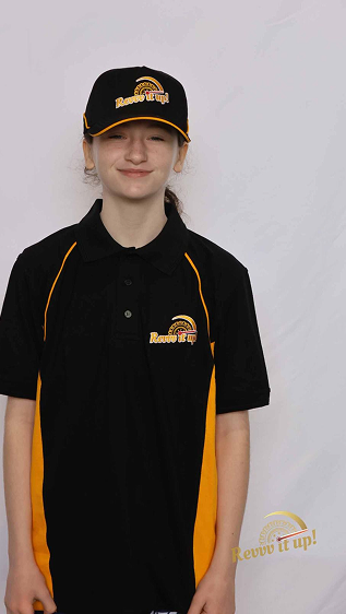 Young girl in a black and yellow uniform with a matching cap, standing against a plain white background.