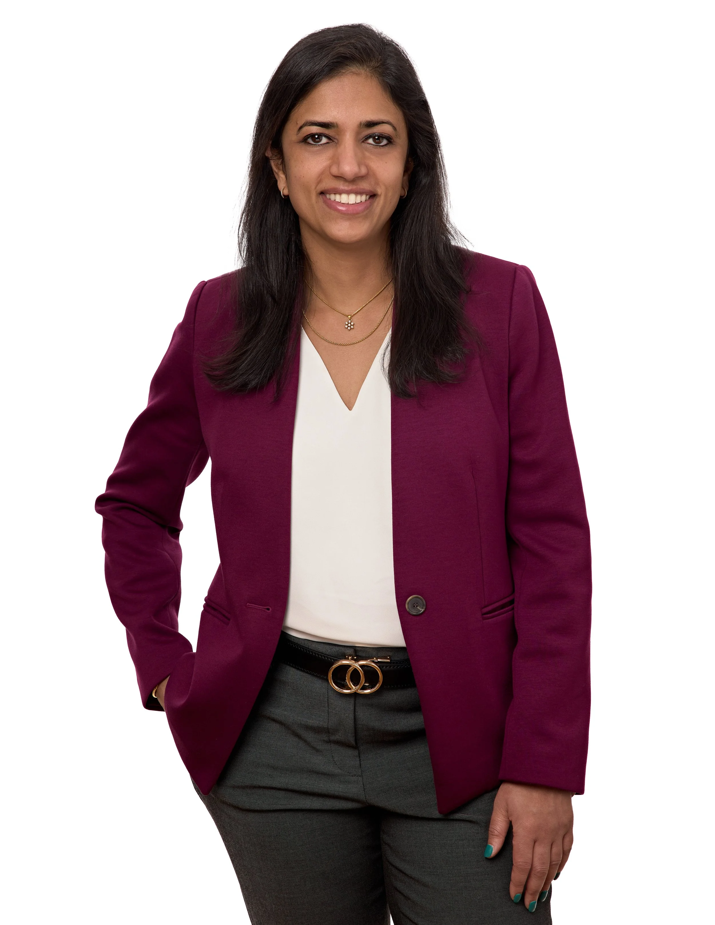 Vasanta Pundarika, founder of Lotuspring, in a burgundy blazer smiling.