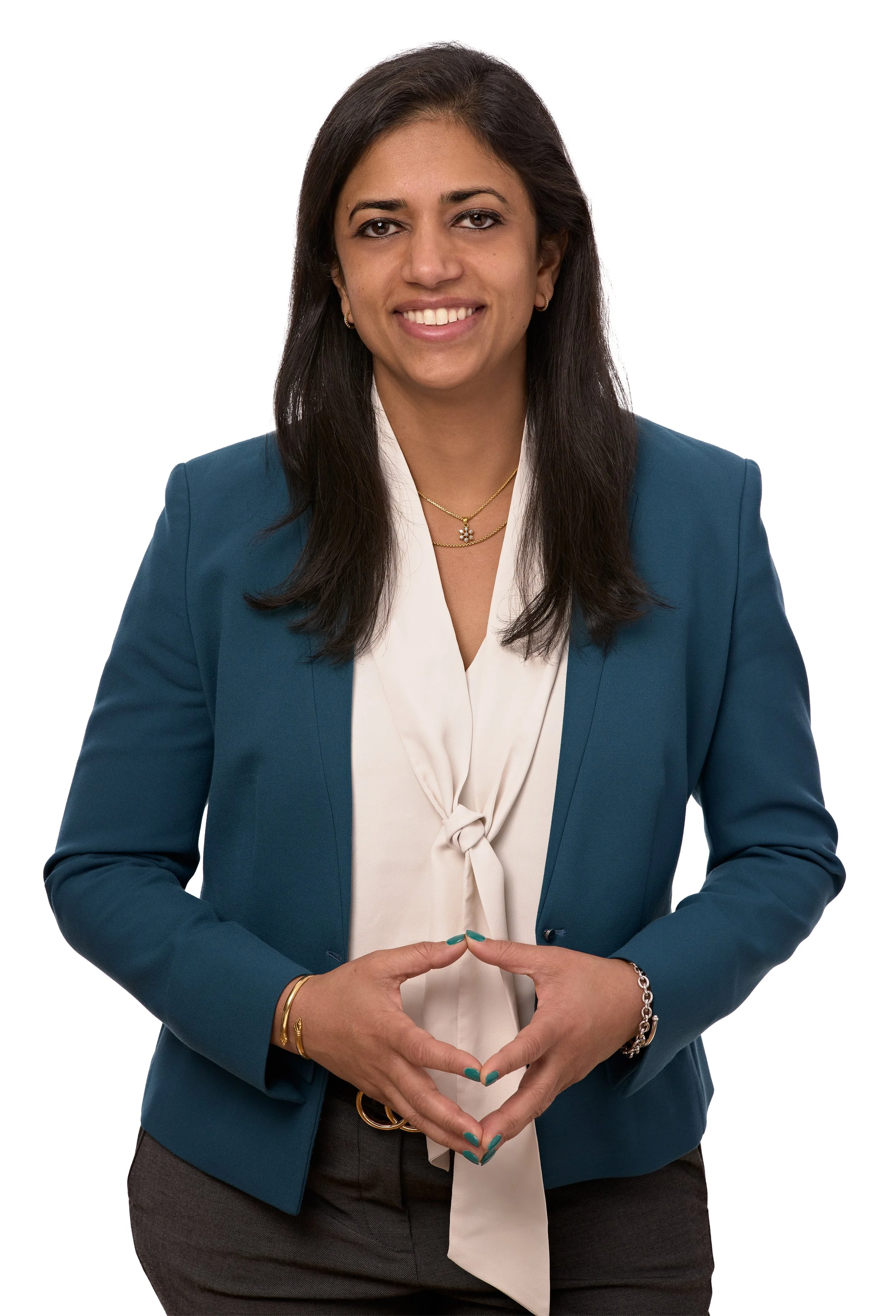 Vasanta Pundarika, founder of Lotuspring, in a burgundy blazer smiling.