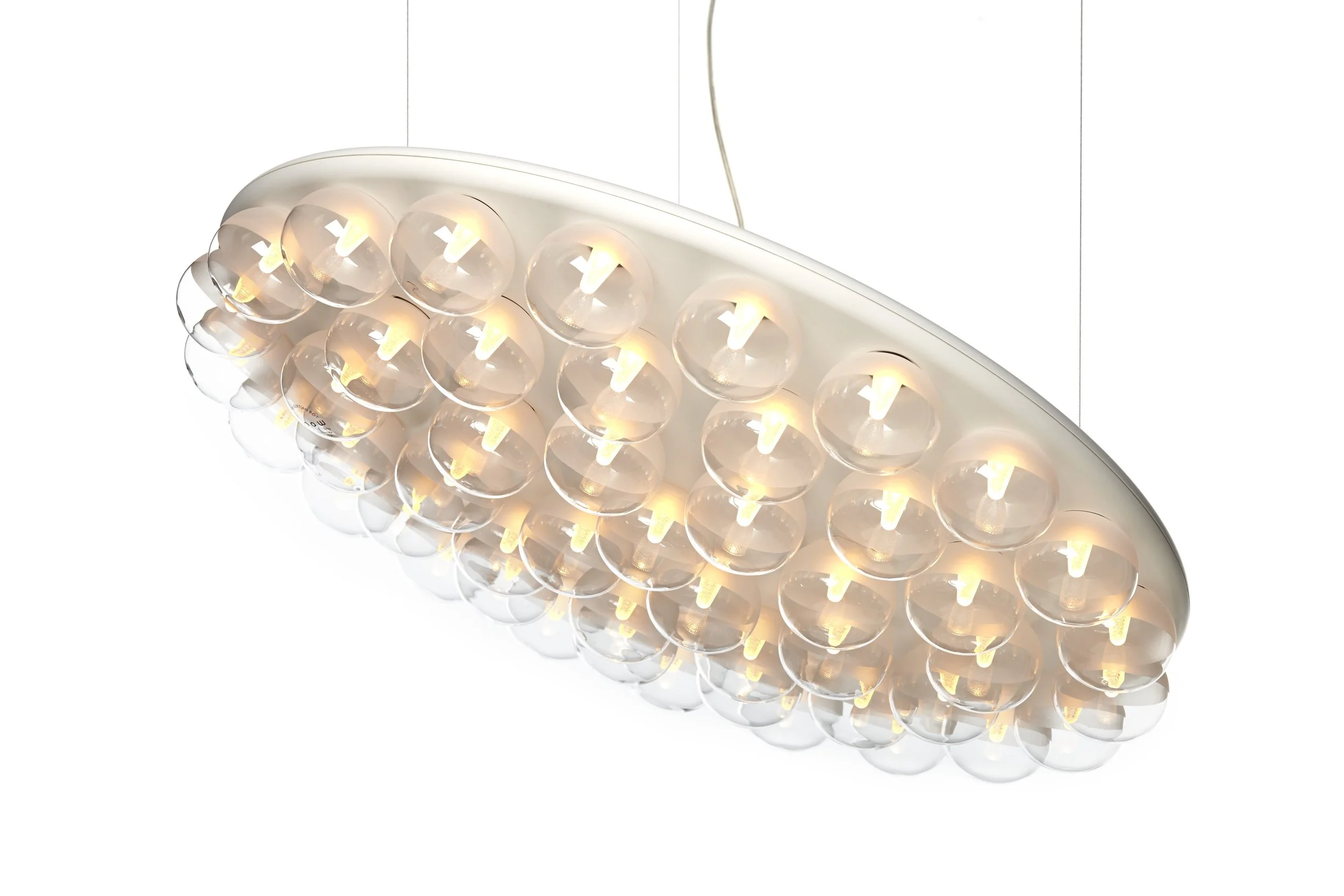 Modern ceiling chandelier with multiple round glass bulbs and warm lighting hanging from a white ceiling.