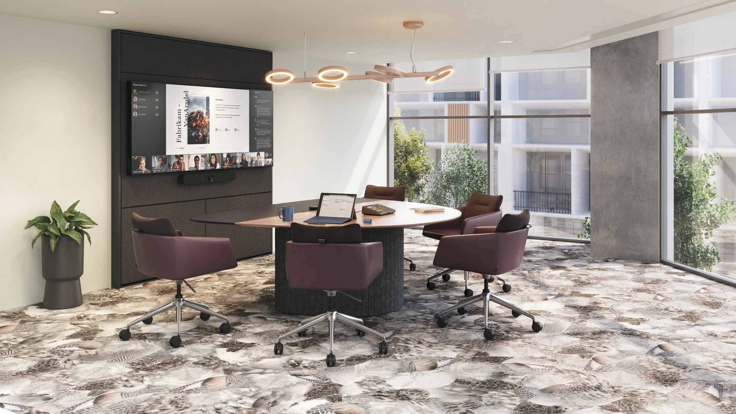 Conference room with round table, desk chairs, and a wall-mounted screen displaying a presentation.